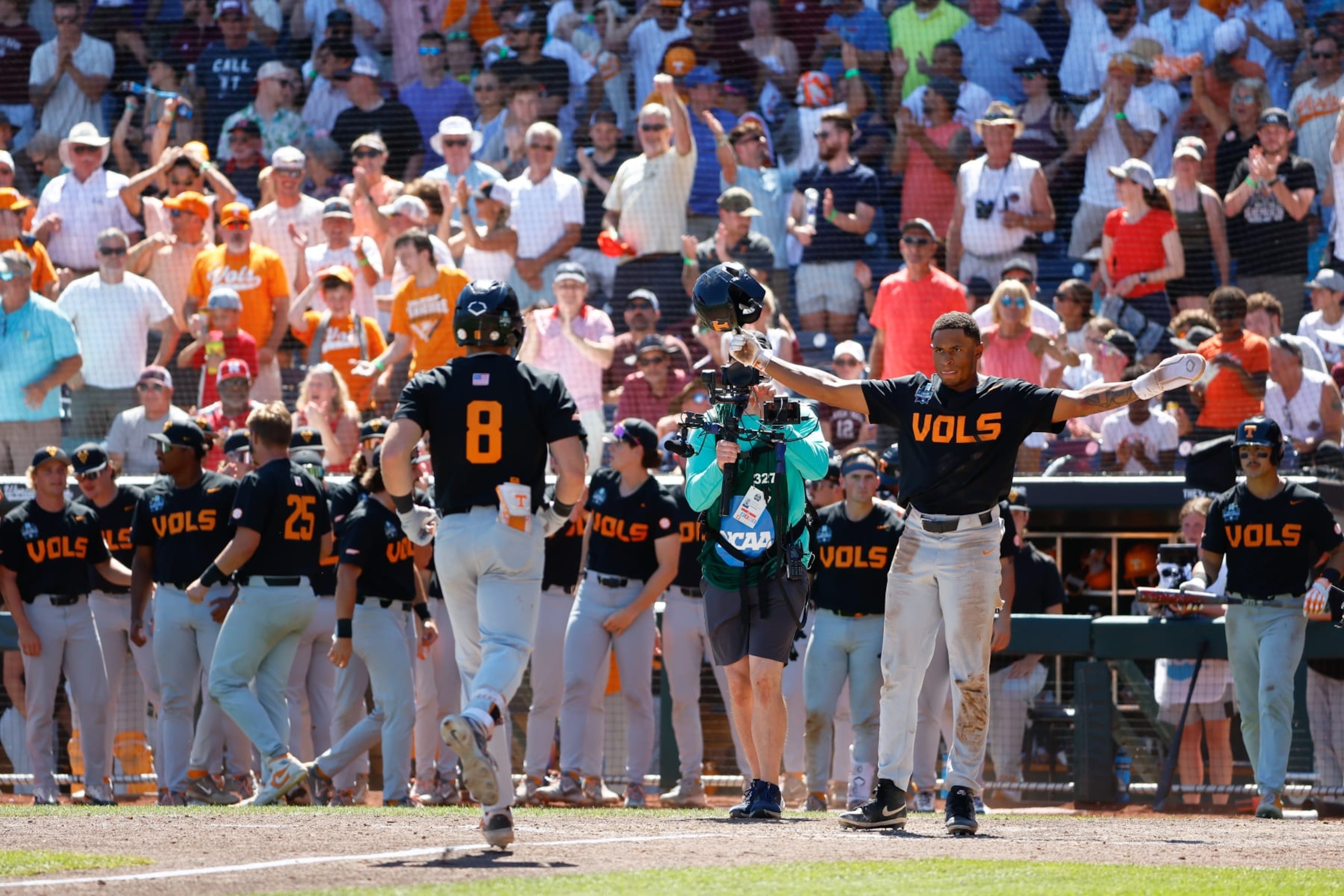 OMAHA, NEBRASKA - JUNE 23: Christian Moore #1 celebrates with Dylan Dreiling #8 of the Tennessee Volunteers after a 2-run home run against the Texas A&M Aggies in the seventh inning during game two of the Division I Men's Baseball Championship held at Charles Schwab Field on June 23, 2024 in Omaha, Nebraska. (Photo by C. Morgan Engel/NCAA Photos via Getty Images) OMAHA, NEBRASKA - JUNE 23: Christian Moore #1 celebrates with Dylan Dreiling #8 of the Tennessee Volunteers after a 2-run home run against the Texas A&M Aggies in the seventh inning during game two of the Division I Men's Baseball Championship held at Charles Schwab Field on June 23, 2024 in Omaha, Nebraska. (Photo by C. Morgan Engel/NCAA Photos via Getty Images)