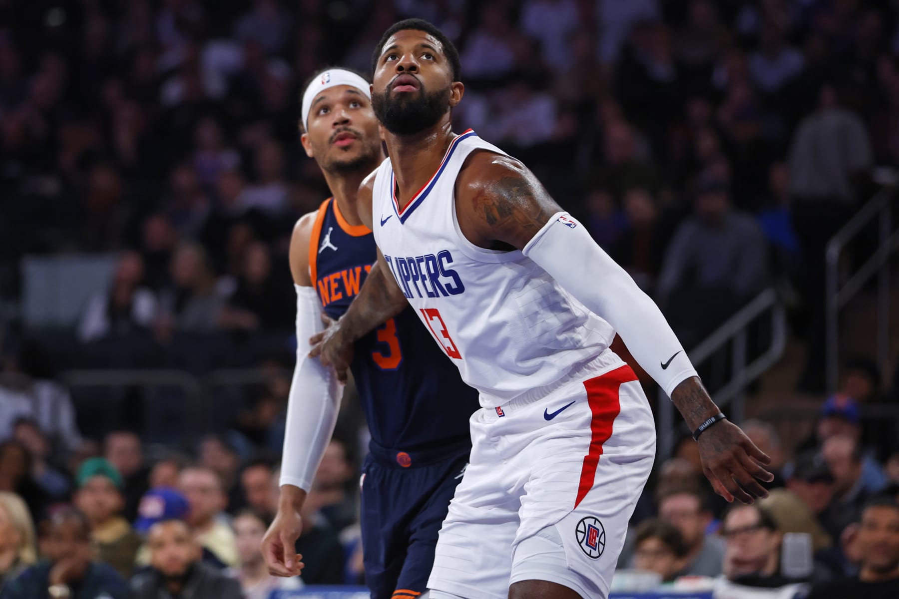 NEW YORK, NEW YORK - NOVEMBER 6: Paul George #13 of the LA Clippers in action against Josh Hart #3 of the New York Knicks during a game at Madison Square Garden on November 6, 2023 in New York City. The Knicks defeated the Clippers 111-97. NOTE TO USER: User expressly acknowledges and agrees that, by downloading and or using this photograph, User is consenting to the terms and conditions of the Getty Images License Agreement. (Photo by Rich Schultz/Getty Images)