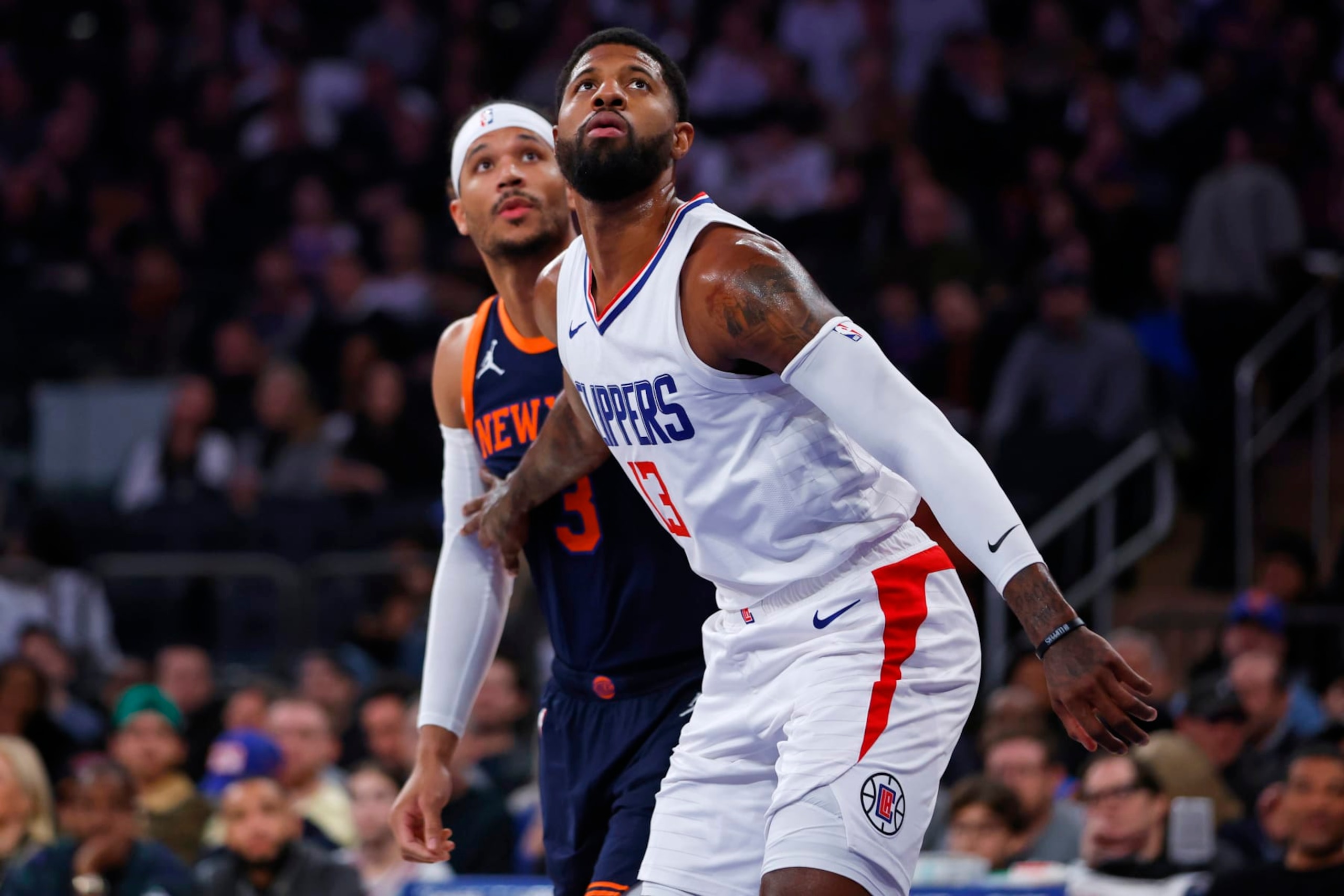 NEW YORK, NEW YORK - NOVEMBER 6: Paul George #13 of the LA Clippers in action against Josh Hart #3 of the New York Knicks during a game at Madison Square Garden on November 6, 2023 in New York City. The Knicks defeated the Clippers 111-97. NOTE TO USER: User expressly acknowledges and agrees that, by downloading and or using this photograph, User is consenting to the terms and conditions of the Getty Images License Agreement. (Photo by Rich Schultz/Getty Images)
