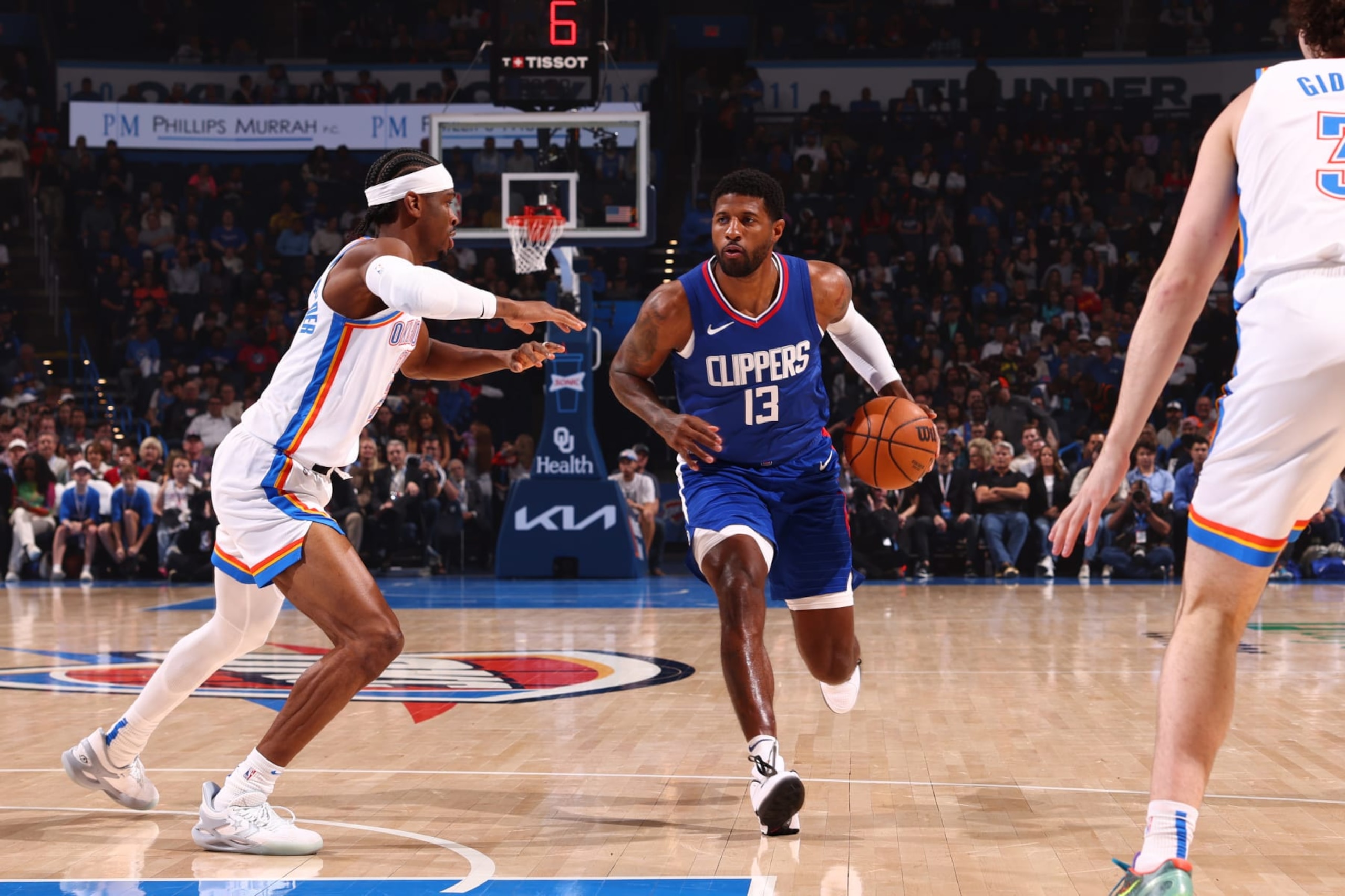 OKLAHOMA CITY, OK - FEBRUARY 22:  Paul George #13 of the LA Clippers handles the ball during the game against the Oklahoma City Thunder on February 22, 2024 at Paycom Arena in Oklahoma City, Oklahoma. NOTE TO USER: User expressly acknowledges and agrees that, by downloading and or using this photograph, User is consenting to the terms and conditions of the Getty Images License Agreement. Mandatory Copyright Notice: Copyright 2024 NBAE (Photo by Zach Beeker/NBAE via Getty Images)