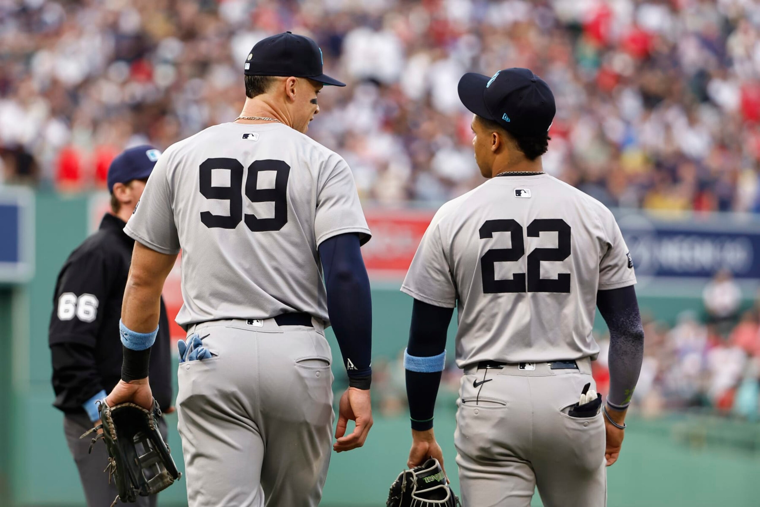 BOSTON, MA - JUNE 16: Aaron Judge #99 of the New York Yankees and Juan Soto #22 talk as they head to the field during the first inning against the Boston Red Sox at Fenway Park on June 16, 2024 in Boston, Massachusetts. (Photo By Winslow Townson/Getty Images)