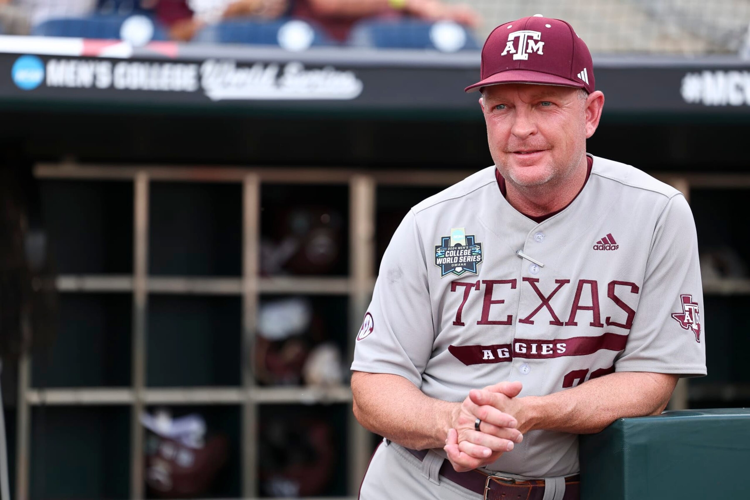 OMAHA, NEBRASKA - JUNE 22: Head coach Jim Schlossnagle of the Texas A&M Aggies looks on before the game against the Tennessee Volunteers during the Division I Men's Baseball Championship held at Charles Schwab Field on June 22, 2024 in Omaha, Nebraska.  (Photo by C. Morgan Engel/NCAA Photos via Getty Images)