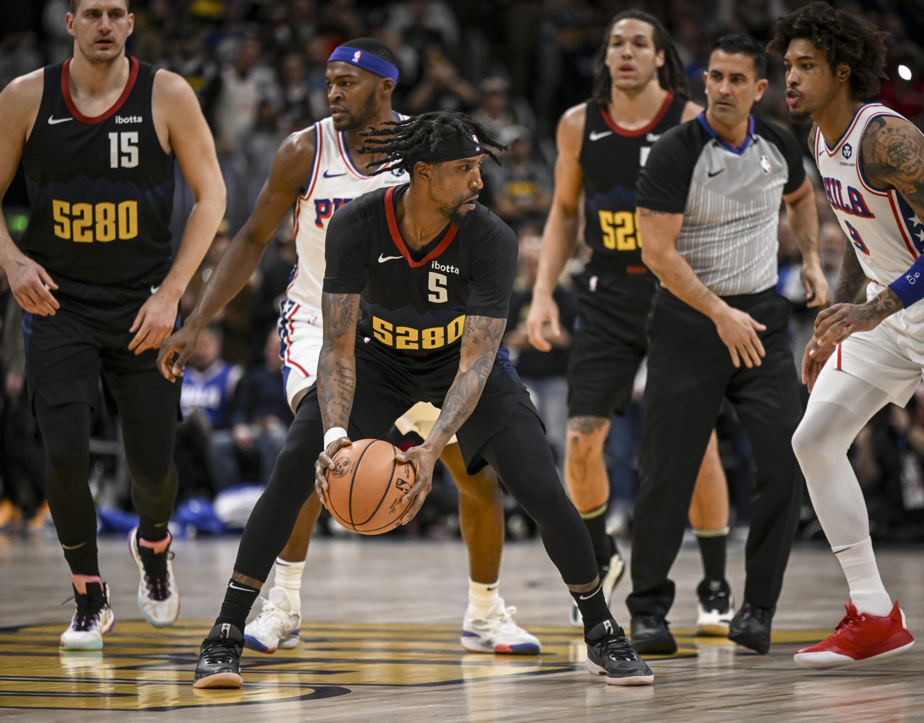 DENVER, CO - JANUARY 27: Kentavious Caldwell-Pope (5) of the Denver Nuggets grabs the tipoff against the Philadelphia 76ers during the first quarter at Ball Arena in Denver on Saturday, January 27, 2024. (Photo by AAron Ontiveroz/The Denver Post)