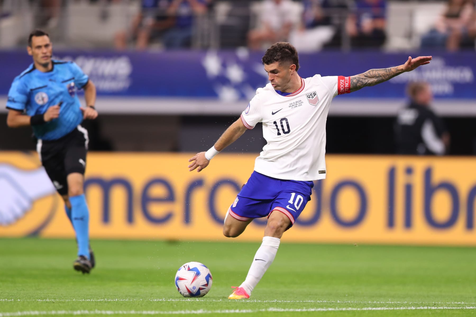 ARLINGTON, TEXAS - JUNE 23: Christian Pulisic of United States kicks the ball during the CONMEBOL Copa America 2024 Group C match between United States and Bolivia at AT&T Stadium on June 23, 2024 in Arlington, Texas. (Photo by Omar Vega/Getty Images)