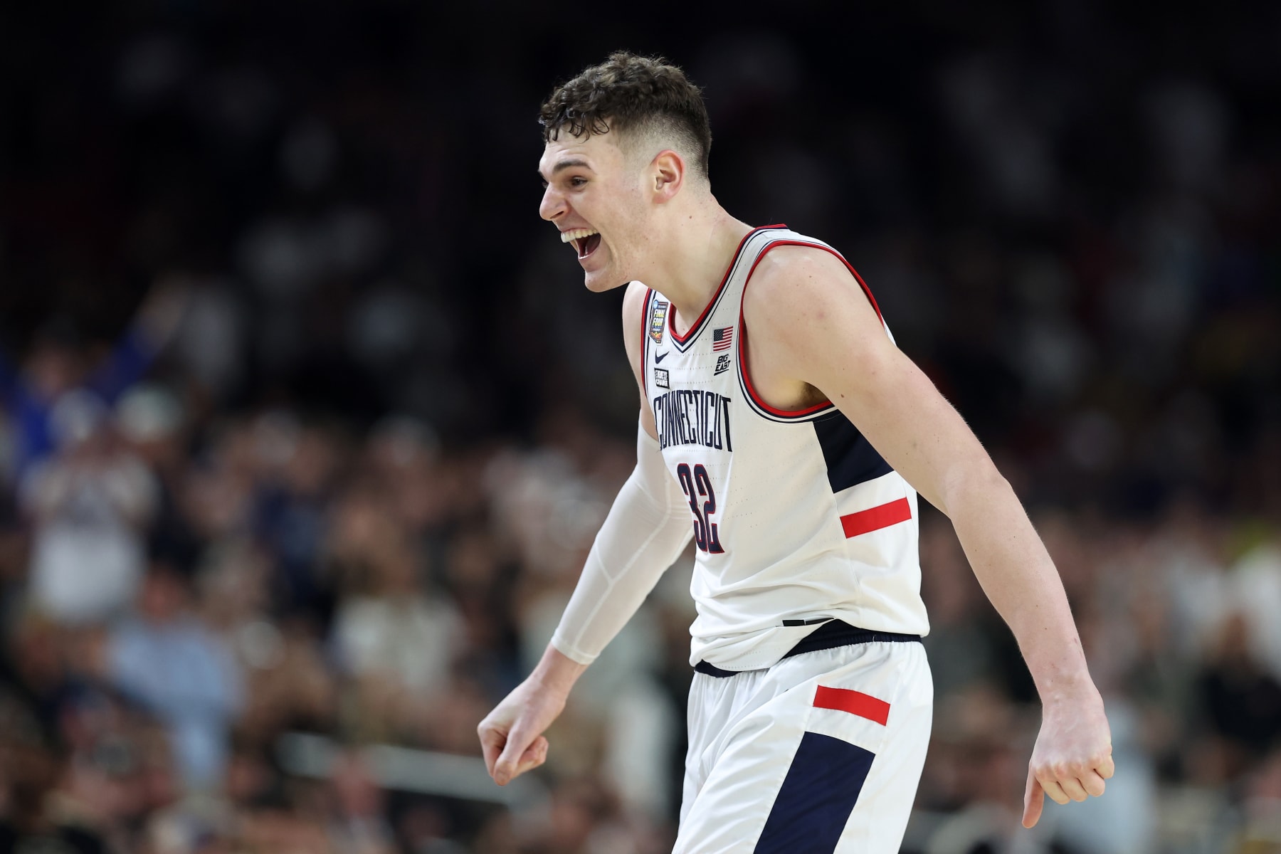 GLENDALE, ARIZONA - APRIL 08: Donovan Clingan #32 of the Connecticut Huskies celebrates after beating the Purdue Boilermakers 75-60 to win the NCAA Men's Basketball Tournament National Championship game at State Farm Stadium on April 08, 2024 in Glendale, Arizona. (Photo by Christian Petersen/Getty Images)