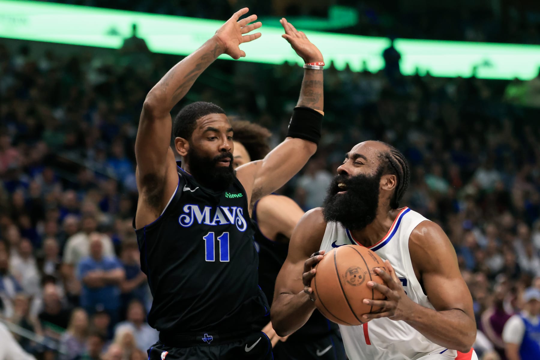 DALLAS, TEXAS - MAY 03: James Harden #1 of the LA Clippers drives to the basket against Kyrie Irving #11 of the Dallas Mavericks during the first quarter in Game Six of the Western Conference First Round Playoffs at American Airlines Center on May 03, 2024 in Dallas, Texas. (Photo by Ron Jenkins/Getty Images)