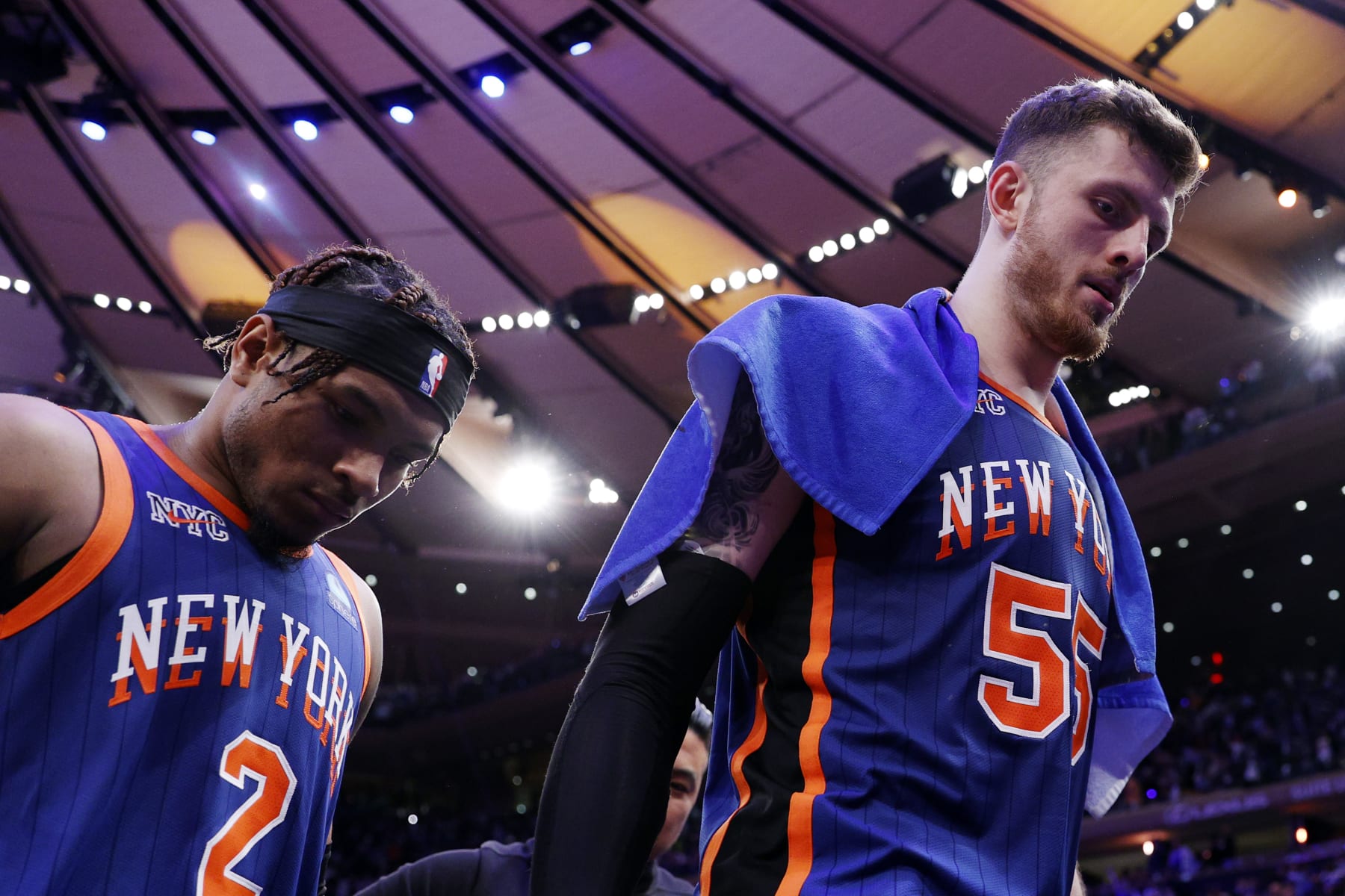 NEW YORK, NEW YORK - MAY 14: Isaiah Hartenstein #55 and Miles McBride #2 of the New York Knicks leave the court after Game Five of the Eastern Conference Second Round Playoffs against the Indiana Pacers at Madison Square Garden on May 14, 2024 in New York City. The Knicks won 121-91. NOTE TO USER: User expressly acknowledges and agrees that, by downloading and or using this photograph, User is consenting to the terms and conditions of the Getty Images License Agreement. (Photo by Sarah Stier/Getty Images)