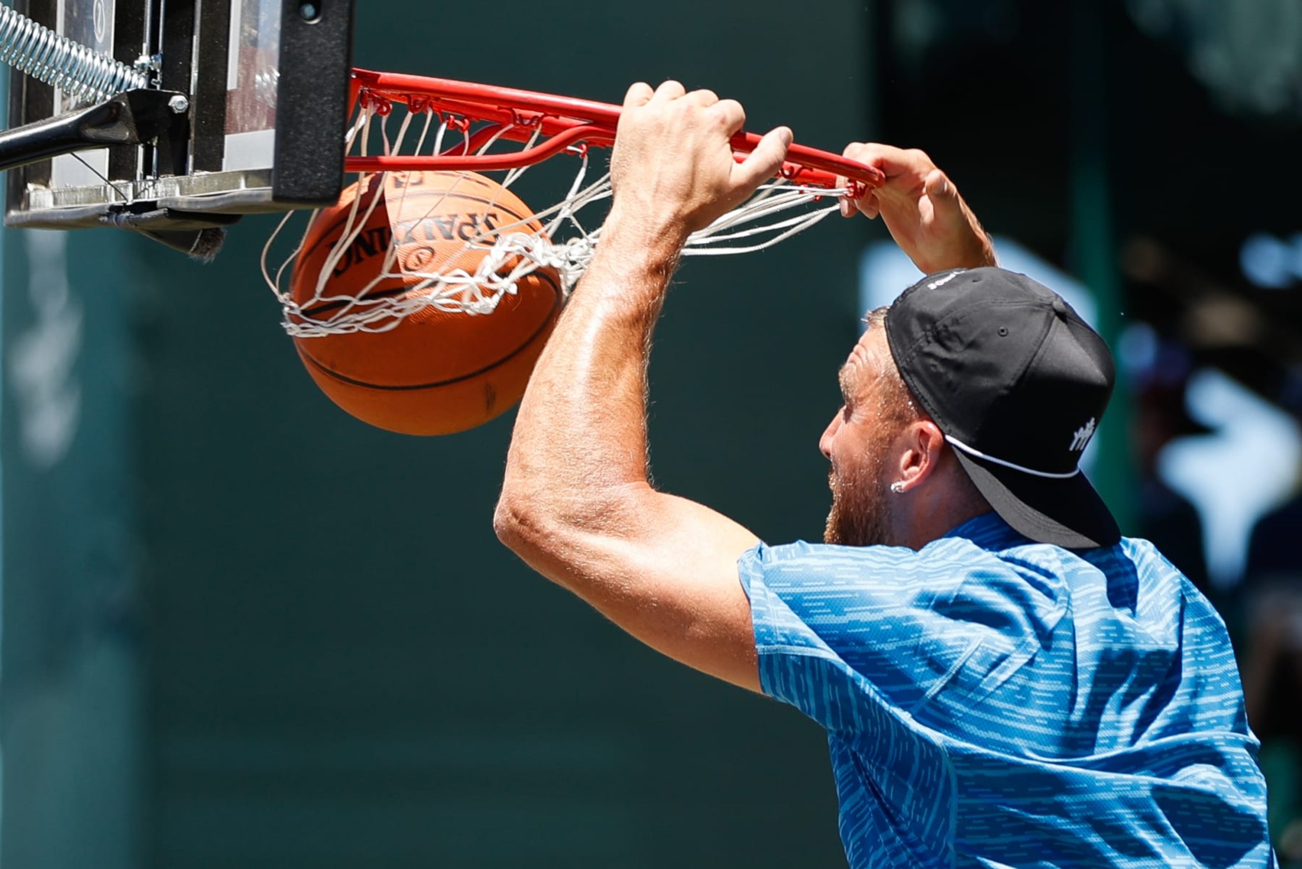 STATELINE, NV - JULY 09: NFL football player Travis Kelce dunks a basketball near hole 17 during Round Two of the 2022 American Century Championship at Edgewood Tahoe Golf Course on July 9, 2022 in Stateline, Nevada. (Photo by Isaiah Vazquez/Clarkson Creative/Getty Images)
