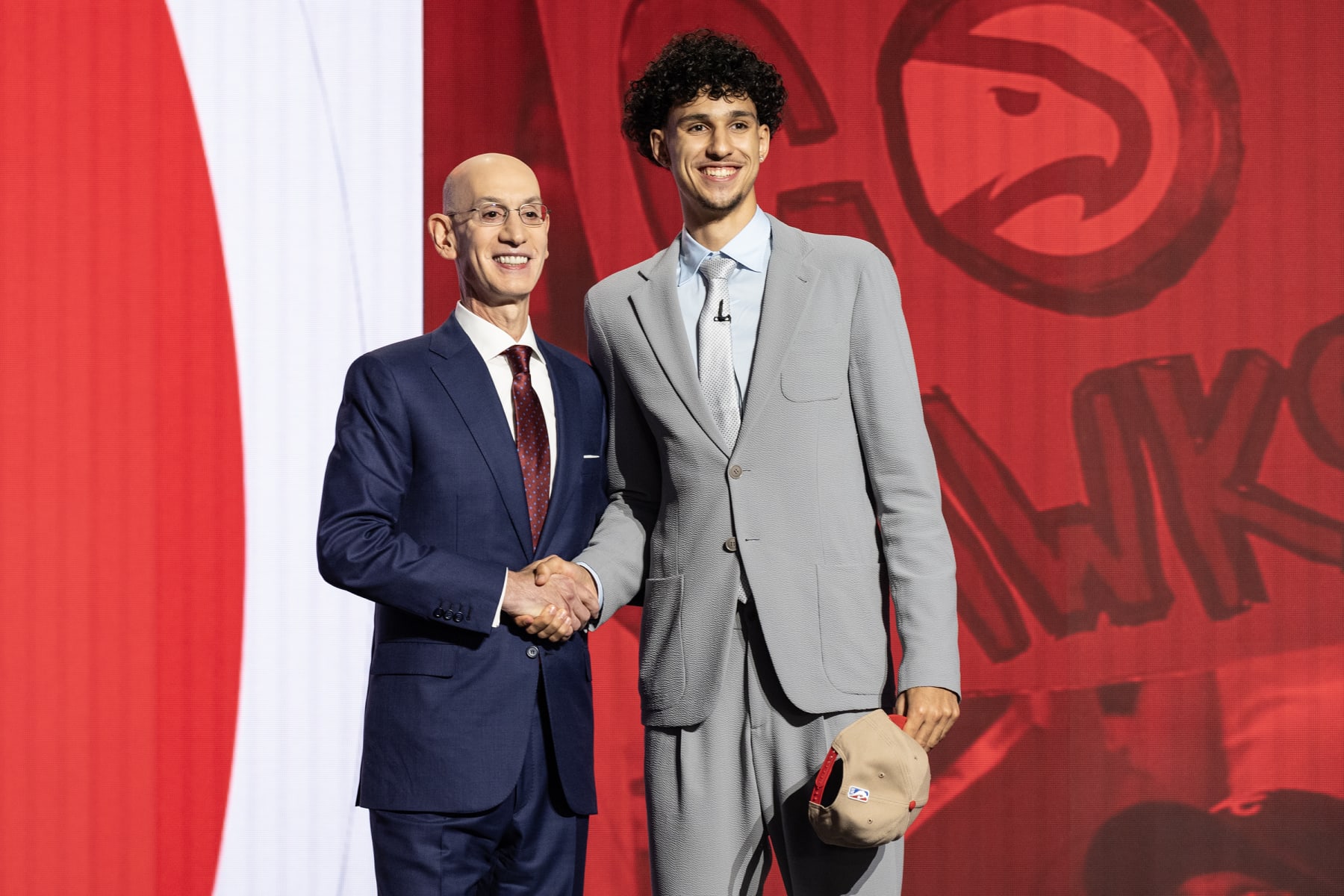 NEW YORK, UNITED STATES - JUNE 26: Commissioner Adam Silver shakes hands with Zaccharie Risacher, selected as number one by the Atlanta Hawks, in the first round of the 2024 NBA Draft at the Barclays Center in Brooklyn, New York on June 26, 2024 (Photo by Lev Radin/Anadolu via Getty Images)