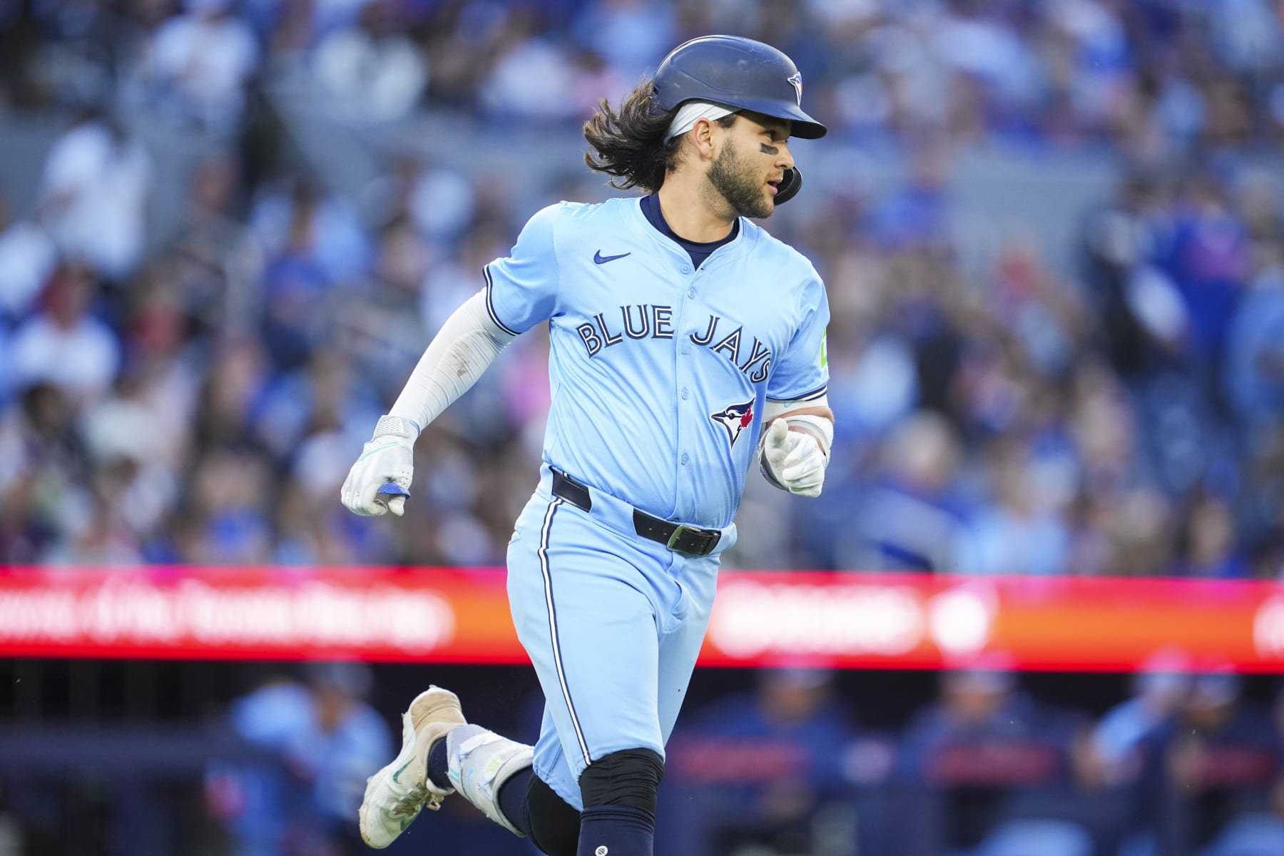 TORONTO, ON - JUNE 14: Bo Bichette #11 of Toronto Blue Jays runs to first base against the Cleveland Guardians during the fourth inning in their MLB game at the Rogers Centre on June 14, 2024 in Toronto, Ontario, Canada. (Photo by Mark Blinch/Getty Images)