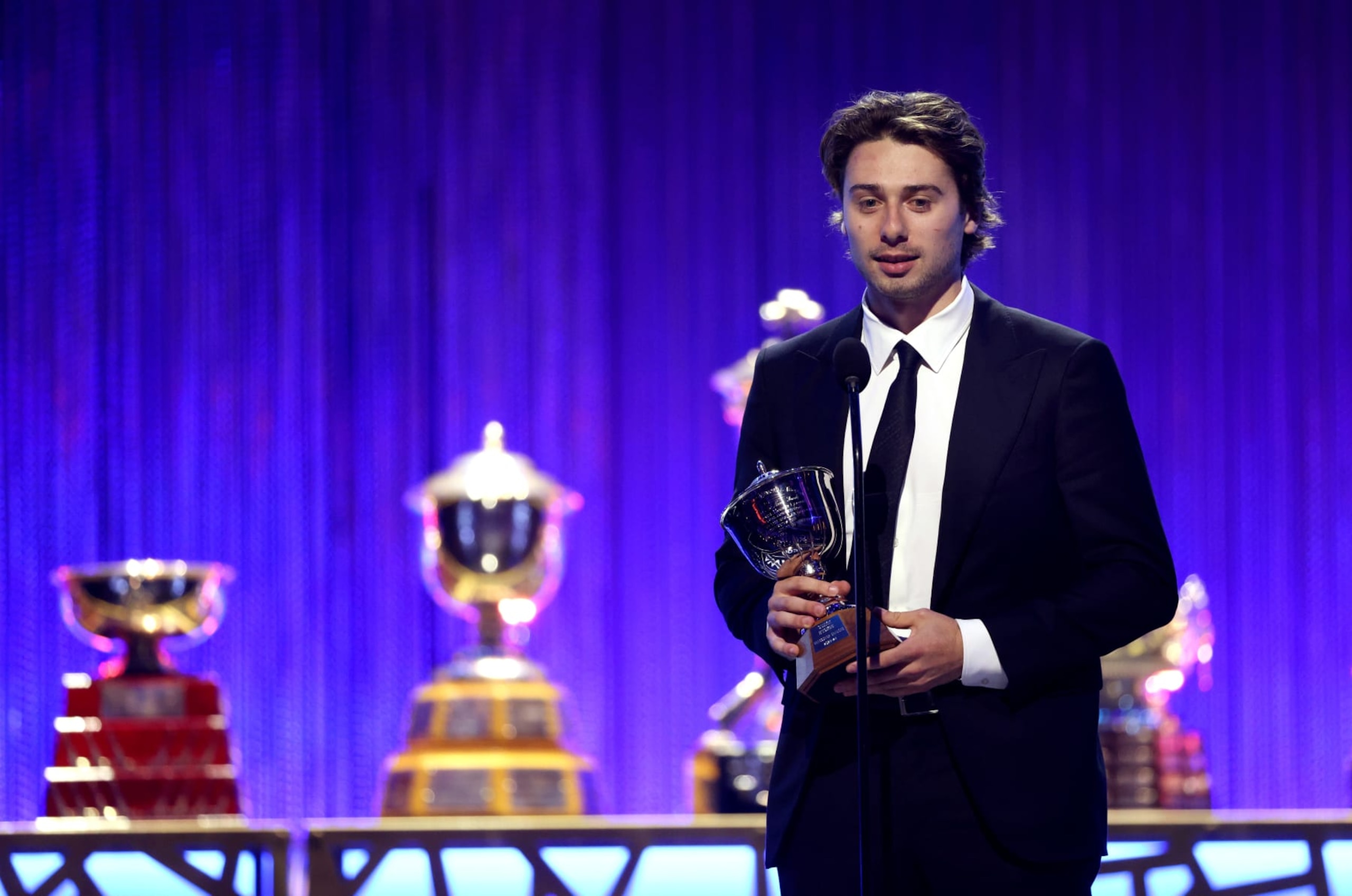 LAS VEGAS, NEVADA - JUNE 27: Quinn Hughes of the Vancouver Canucks speaks onstage after being awarded the Norris Trophy during the 2024 NHL Awards Show at BleauLive Theater at Fontainebleau Las Vegas on June 27, 2024 in Las Vegas, Nevada. (Photo by Dave Sandford/NHLI via Getty Images)