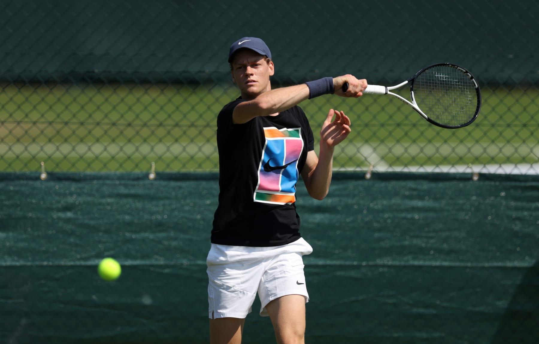 LONDON, ENGLAND - JUNE 26: Jannik Sinner of Italy plays a forehand during practice prior to The Championships Wimbledon 2024 at All England Lawn Tennis and Croquet Club on June 26, 2024 in London, England. (Photo by Clive Brunskill/Getty Images)