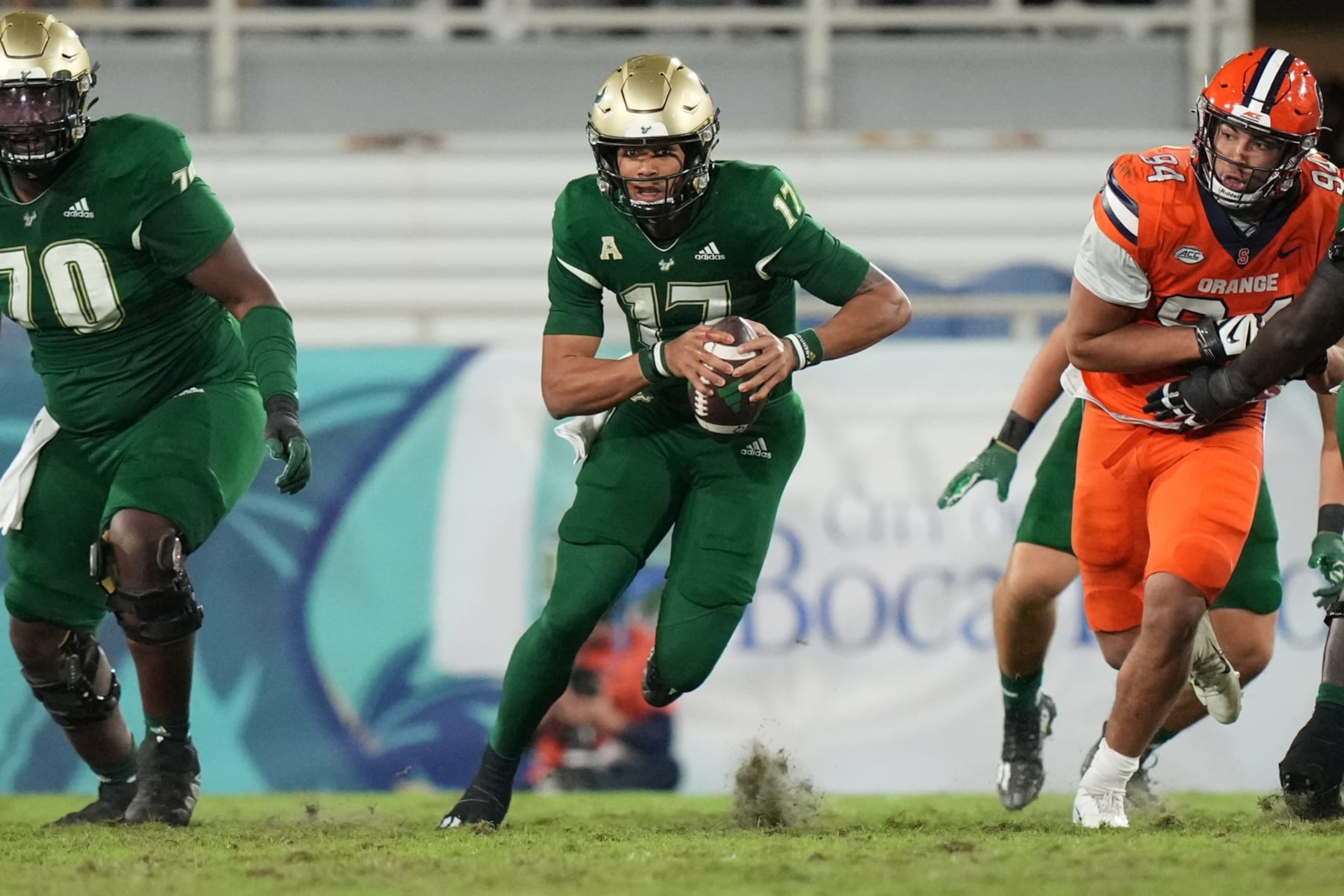 BOCA RATON, FL - DECEMBER 21: South Florida Bulls quarterback Byrum Brown (17) rushes for a first down on a keeper play during the RoomClaim.com Boca Raton Bowl game between the Syracuse Orange and the South Florida (USF) Bulls (Photo by Peter Joneleit/Icon Sportswire via Getty Images) BOCA RATON, FL - DECEMBER 21: South Florida Bulls quarterback Byrum Brown (17) rushes for a first down on a keeper play during the RoomClaim.com Boca Raton Bowl game between the Syracuse Orange and the South Florida (USF) Bulls (Photo by Peter Joneleit/Icon Sportswire via Getty Images)