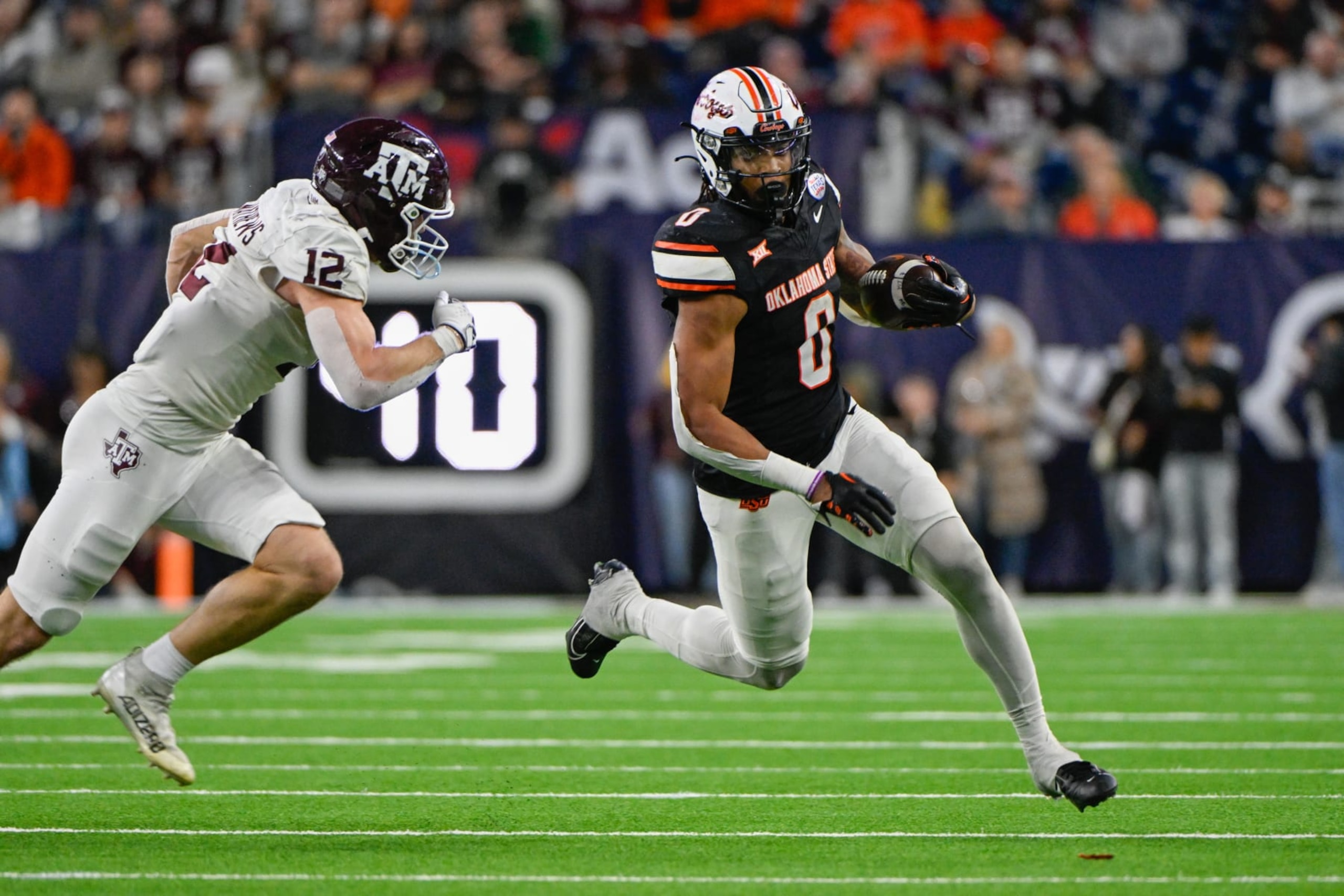 HOUSTON, TX - DECEMBER 27: Oklahoma State Cowboys running back Ollie Gordon II (0) attempts to get to the edge as Texas A&M Aggies linebacker Sam Mathews (12) gives chase during the TaxAct Texas Bowl between the Texas A&M Aggies and Oklahoma State Cowboys at NRG Stadium on December 27, 2023 in Houston, Texas. (Photo by Ken Murray/Icon Sportswire via Getty Images) HOUSTON, TX - DECEMBER 27: Oklahoma State Cowboys running back Ollie Gordon II (0) attempts to get to the edge as Texas A&M Aggies linebacker Sam Mathews (12) gives chase during the TaxAct Texas Bowl between the Texas A&M Aggies and Oklahoma State Cowboys at NRG Stadium on December 27, 2023 in Houston, Texas. (Photo by Ken Murray/Icon Sportswire via Getty Images)