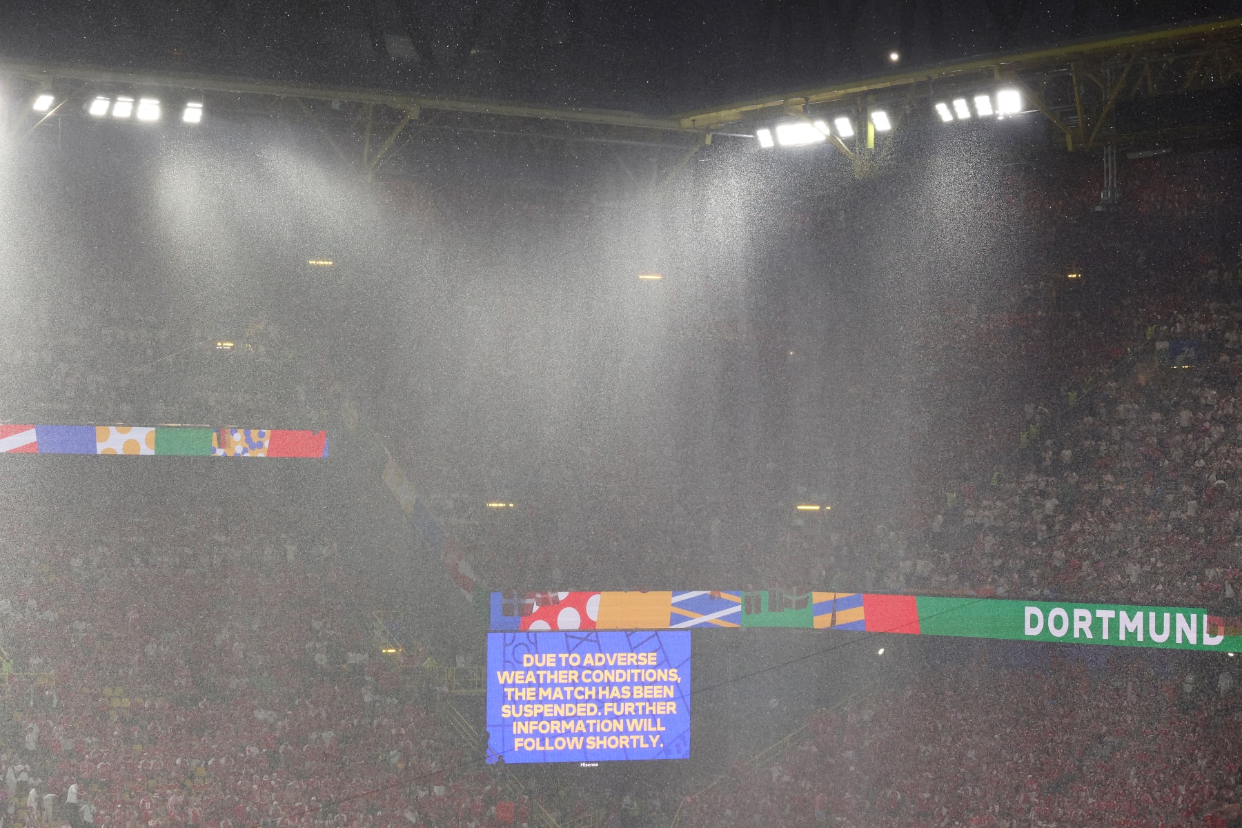 DORTMUND, GERMANY - JUNE 29: The LED board shows the message "due to adverse weather conditions, the match has been suspended. Further information will follow shortly" during the UEFA EURO 2024 round of 16 match between Germany and Denmark at Football Stadium Dortmund on June 29, 2024 in Dortmund, Germany. (Photo by Alex Livesey/Getty Images)