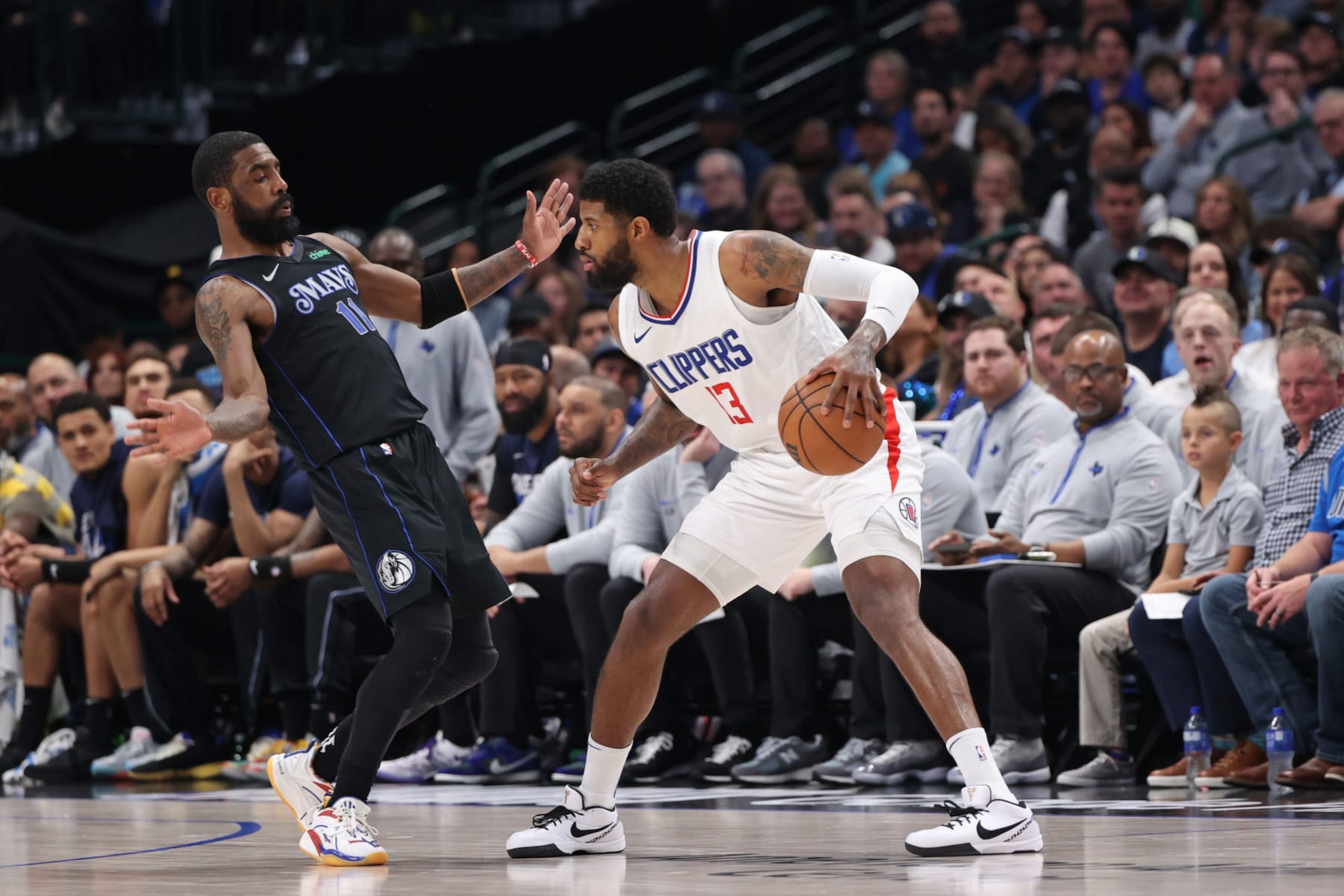 DALLAS, TX - MAY 3: Paul George #13 of the LA Clippers dribbles the ball during the game against the Dallas Mavericks during Round 1 Game 6 of the 2024 NBA Playoffs on May 3, 2024 at the American Airlines Center in Dallas, Texas. NOTE TO USER: User expressly acknowledges and agrees that, by downloading and or using this photograph, User is consenting to the terms and conditions of the Getty Images License Agreement. Mandatory Copyright Notice: Copyright 2024 NBAE (Photo by Joe Murphy/NBAE via Getty Images) DALLAS, TX - MAY 3: Paul George #13 of the LA Clippers dribbles the ball during the game against the Dallas Mavericks during Round 1 Game 6 of the 2024 NBA Playoffs on May 3, 2024 at the American Airlines Center in Dallas, Texas. NOTE TO USER: User expressly acknowledges and agrees that, by downloading and or using this photograph, User is consenting to the terms and conditions of the Getty Images License Agreement. Mandatory Copyright Notice: Copyright 2024 NBAE (Photo by Joe Murphy/NBAE via Getty Images)
