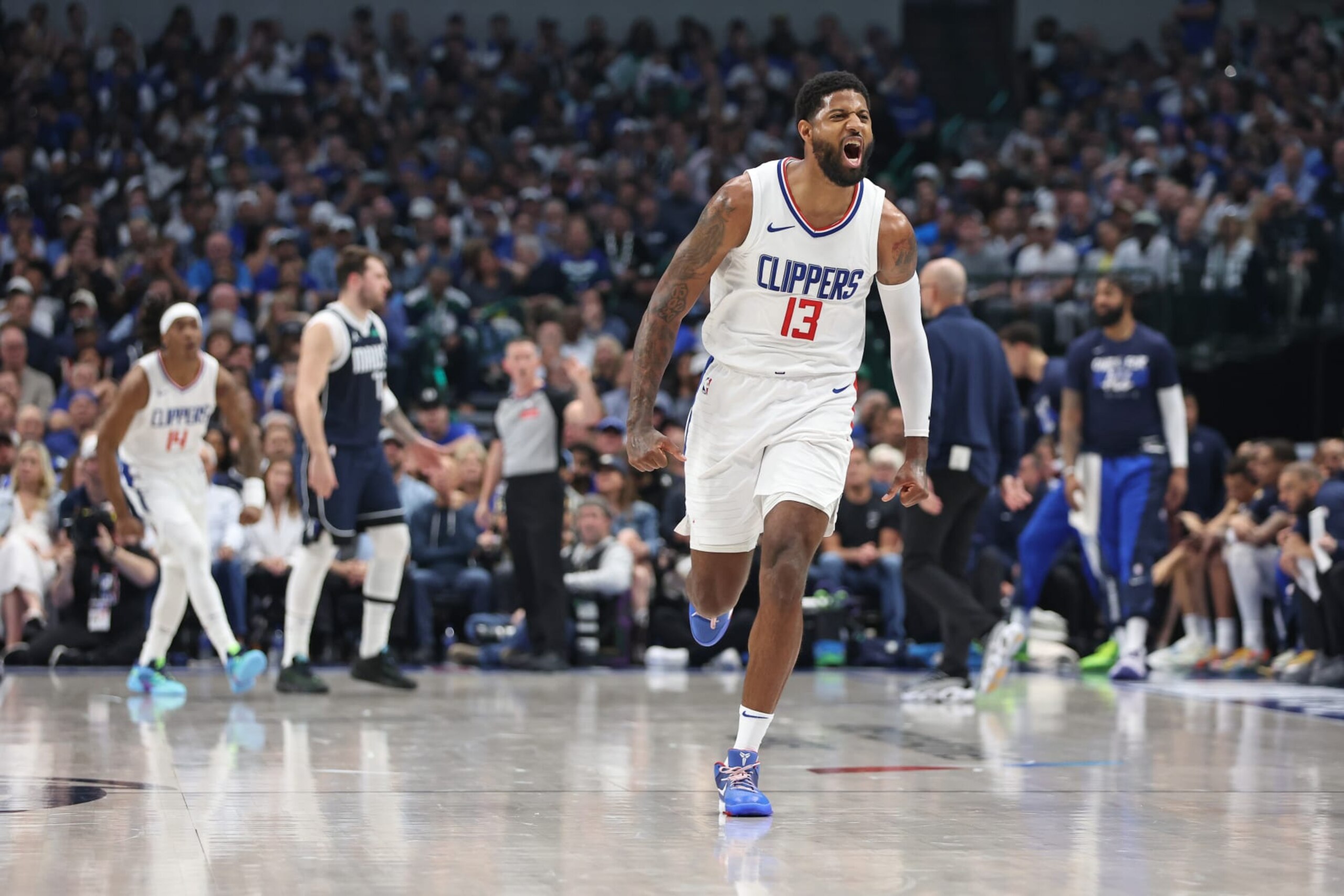 DALLAS, TX - APRIL 28: Paul George #13 of the LA Clippers celebrates during the game against the Dallas Mavericks during Round 1 Game 4 of the 2024 NBA Playoffs on April 28, 2024 at the American Airlines Center in Dallas, Texas. NOTE TO USER: User expressly acknowledges and agrees that, by downloading and or using this photograph, User is consenting to the terms and conditions of the Getty Images License Agreement. Mandatory Copyright Notice: Copyright 2024 NBAE (Photo by Tim Heitman/NBAE via Getty Images) DALLAS, TX - APRIL 28: Paul George #13 of the LA Clippers celebrates during the game against the Dallas Mavericks during Round 1 Game 4 of the 2024 NBA Playoffs on April 28, 2024 at the American Airlines Center in Dallas, Texas. NOTE TO USER: User expressly acknowledges and agrees that, by downloading and or using this photograph, User is consenting to the terms and conditions of the Getty Images License Agreement. Mandatory Copyright Notice: Copyright 2024 NBAE (Photo by Tim Heitman/NBAE via Getty Images)