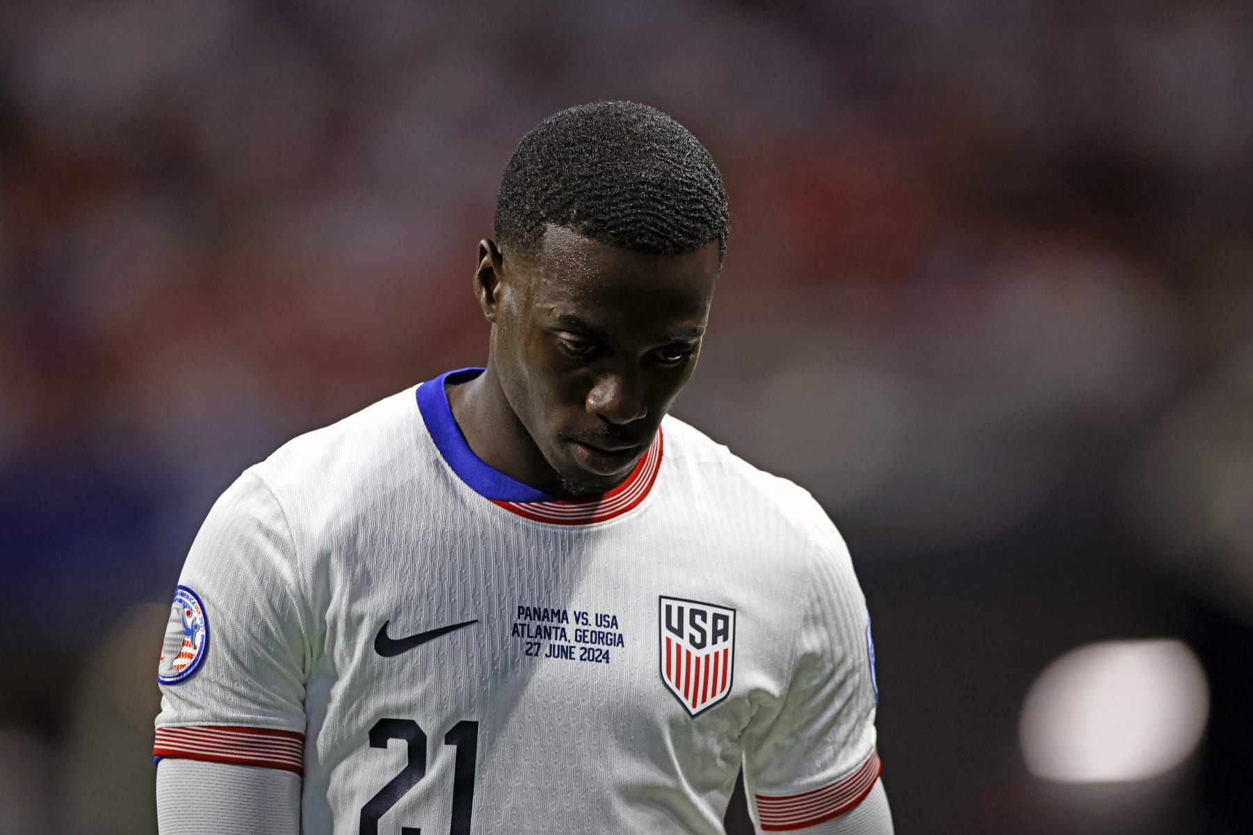 USA's forward #21 Tim Weah looks down as he leaves the pitch after being shown a red card during the Conmebol 2024 Copa America tournament group C football match between Panama and USA at Mercedes Benz Stadium in Atlanta, Georgia, on June 27, 2024. (Photo by EDUARDO MUNOZ / AFP) (Photo by EDUARDO MUNOZ/AFP via Getty Images)