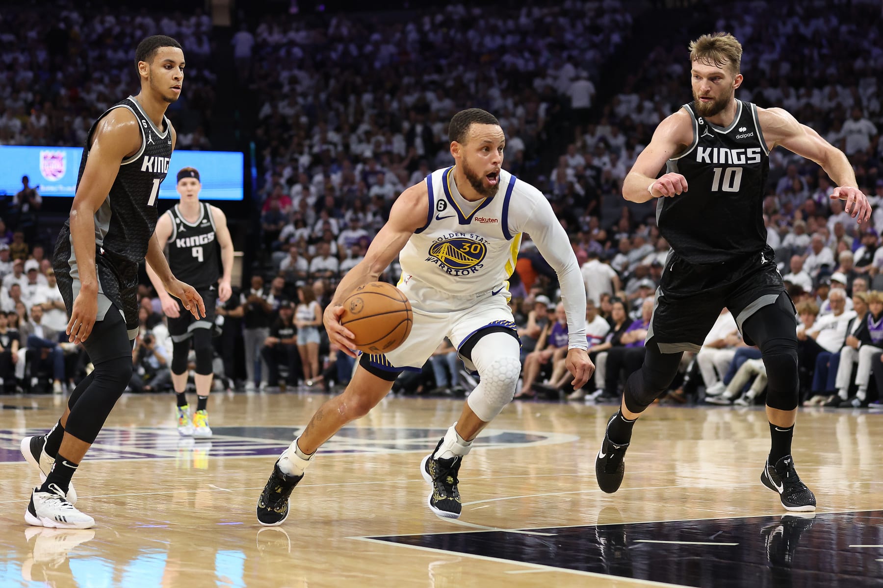 SACRAMENTO, CALIFORNIA - APRIL 30: Stephen Curry #30 of the Golden State Warriors dribbles against the Sacramento Kings during the fourth quarter in game seven of the Western Conference First Round Playoffs at Golden 1 Center on April 30, 2023 in Sacramento, California. NOTE TO USER: User expressly acknowledges and agrees that, by downloading and or using this photograph, User is consenting to the terms and conditions of the Getty Images License Agreement. (Photo by Ezra Shaw/Getty Images)