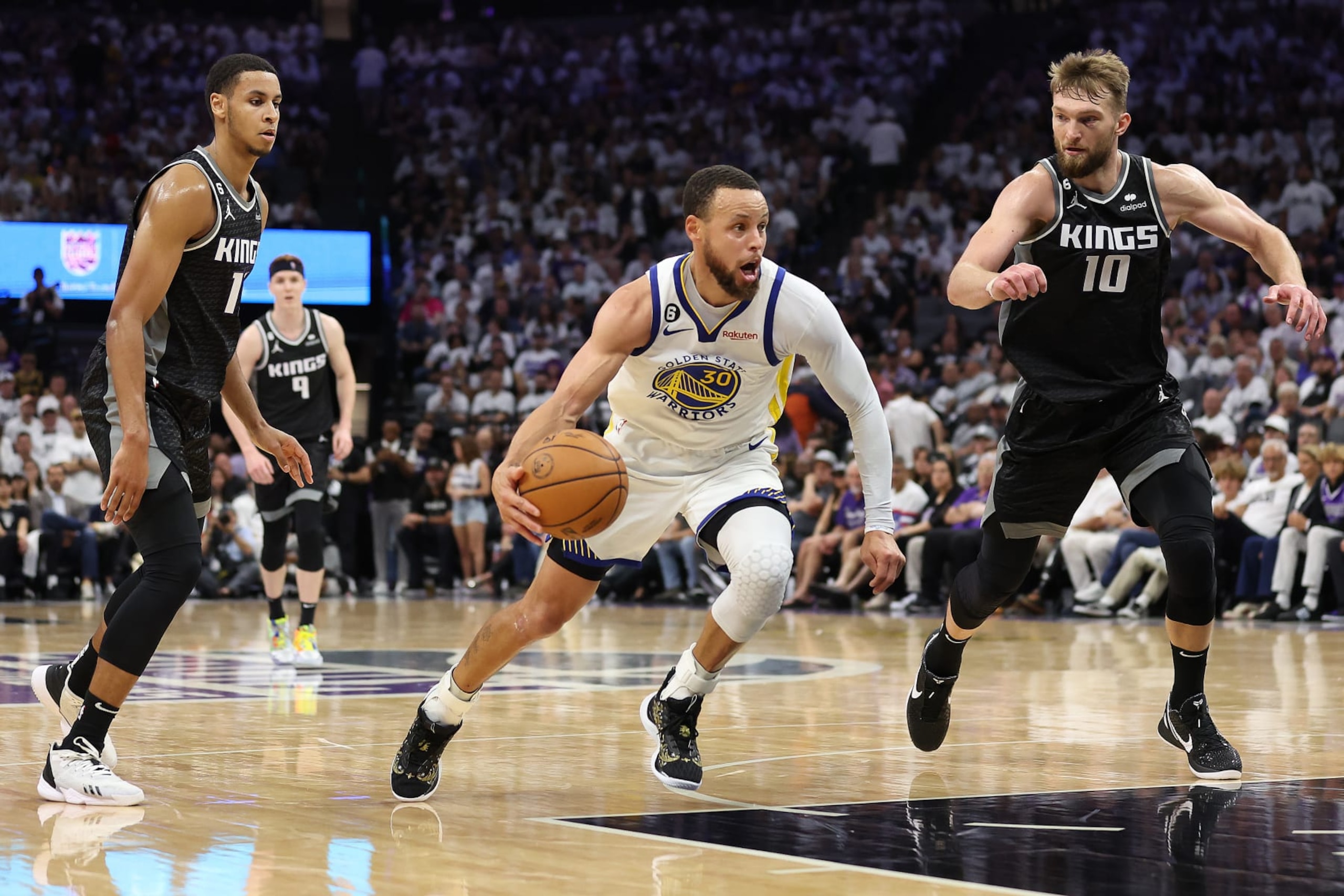 SACRAMENTO, CALIFORNIA - APRIL 30: Stephen Curry #30 of the Golden State Warriors dribbles against the Sacramento Kings during the fourth quarter in game seven of the Western Conference First Round Playoffs at Golden 1 Center on April 30, 2023 in Sacramento, California. NOTE TO USER: User expressly acknowledges and agrees that, by downloading and or using this photograph, User is consenting to the terms and conditions of the Getty Images License Agreement. (Photo by Ezra Shaw/Getty Images)