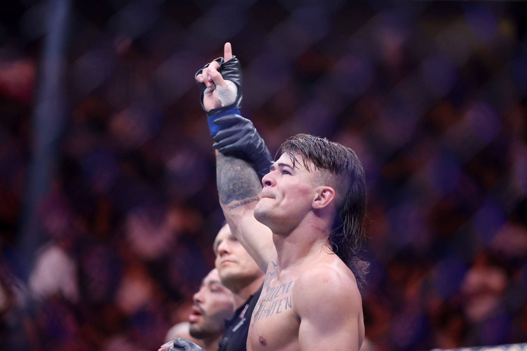 Diego Lopes has his hand raised after defeating Dan Ige.