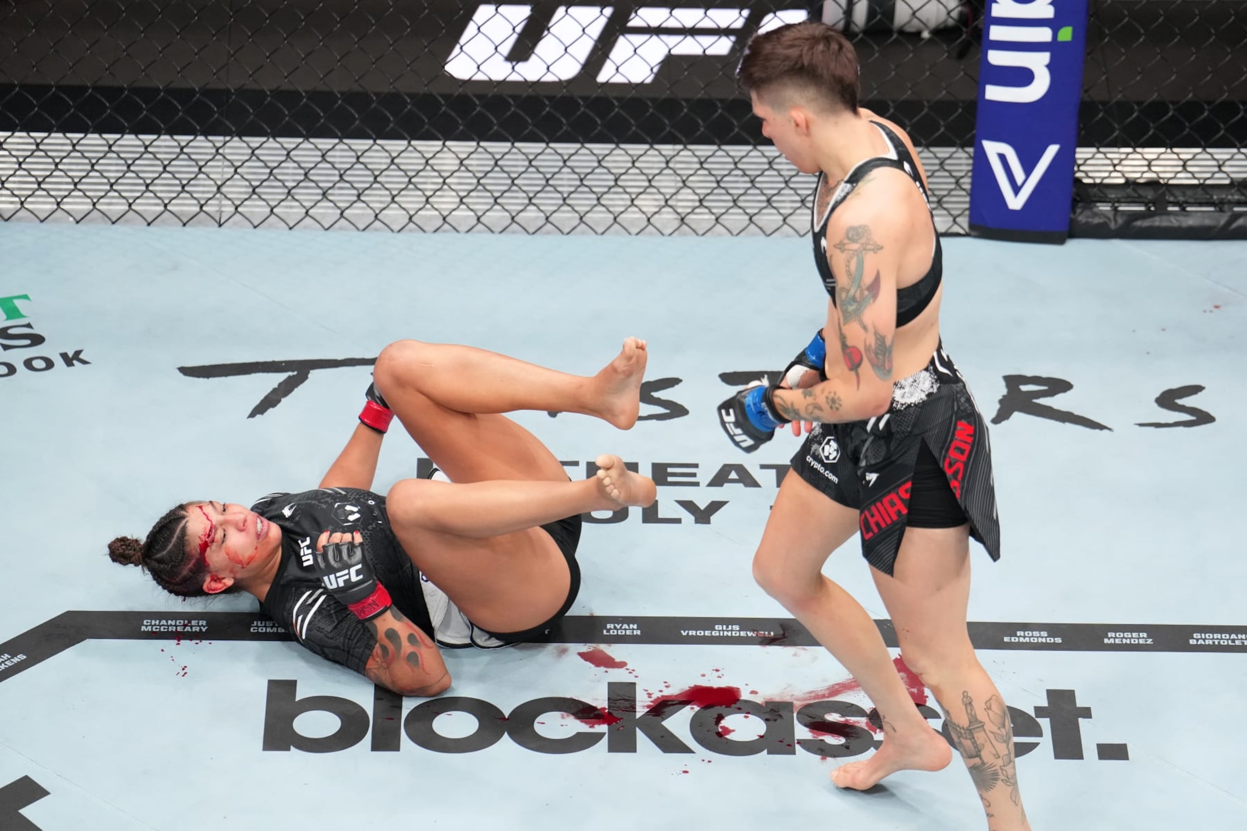 Macy Chiasson stands over Mayra Bueno Silva. Macy Chiasson stands over Mayra Bueno Silva.