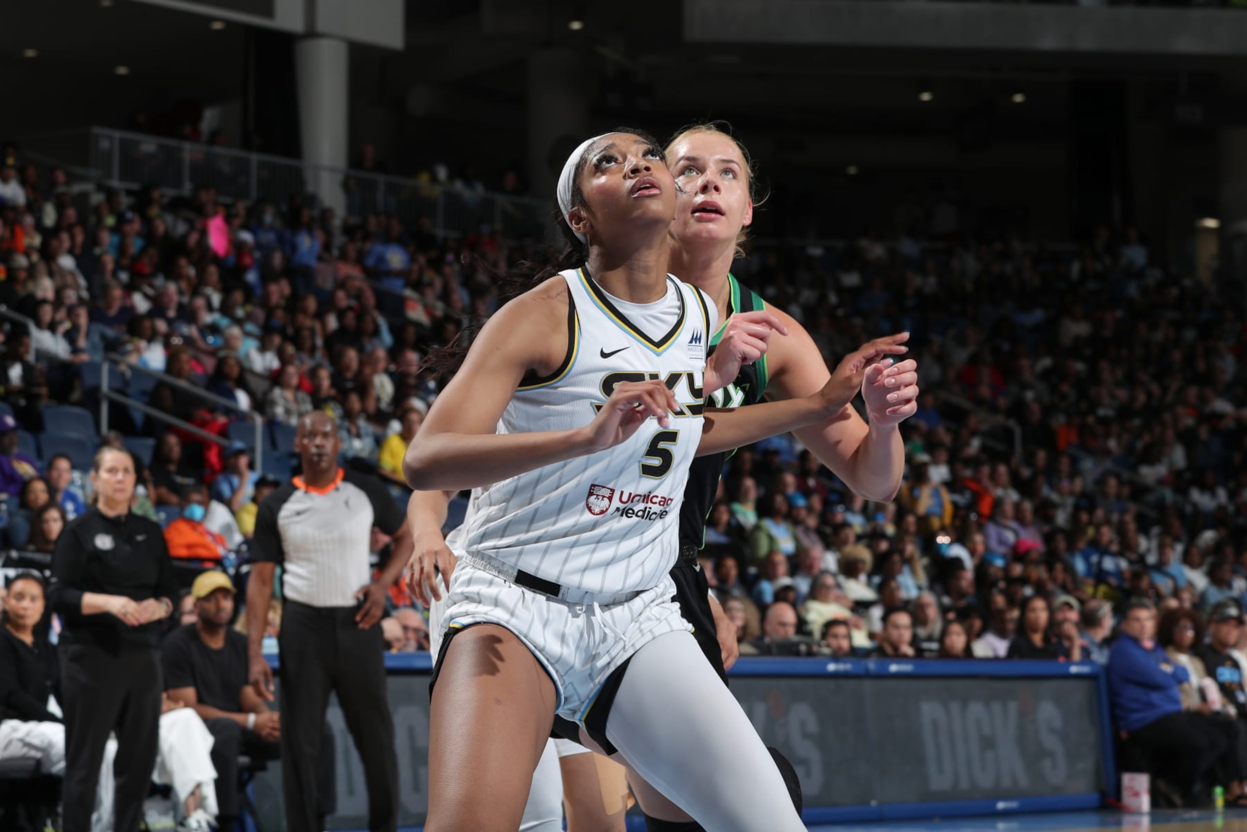 CHICAGO, IL -  JUNE 30:  Angel Reese #5 of the Chicago Sky boxes out Dorka Juhász #14 of the Minnesota Lynx during the game  on June 30, 2024 at the Wintrust Arena in Chicago, IL. NOTE TO USER: User expressly acknowledges and agrees that, by downloading and or using this photograph, User is consenting to the terms and conditions of the Getty Images License Agreement. Mandatory Copyright Notice: Copyright 2024 NBAE (Photo by Gary Dineen/NBAE via Getty Images)