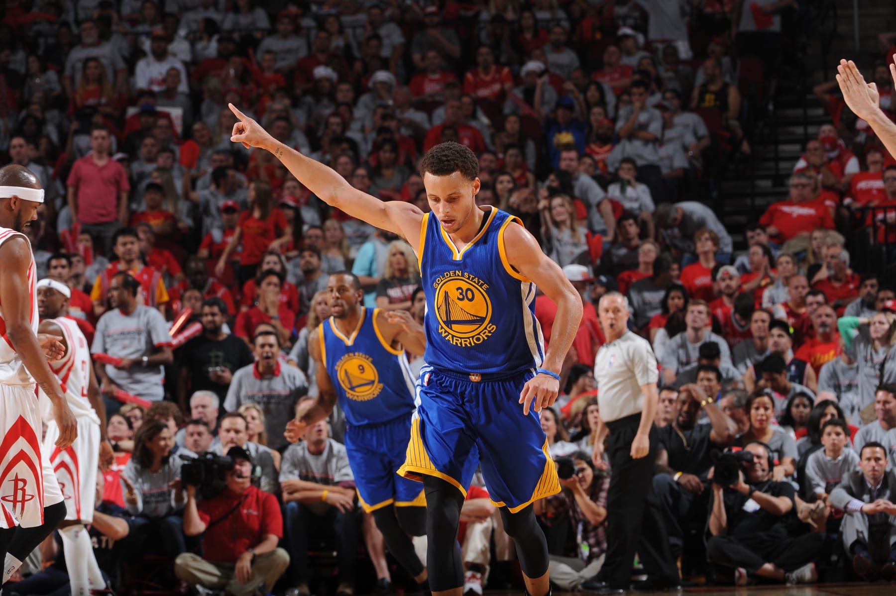 HOUSTON, TX - MAY 23:  Stephen Curry #30 of the Golden State Warriors celebrates in Game Three of the Western Conference Finals against the Houston Rockets during the 2015 NBA Playoffs on May 23, 2015 at the Toyota Center in Houston, Texas. NOTE TO USER: User expressly acknowledges and agrees that, by downloading and or using this photograph, User is consenting to the terms and conditions of the Getty Images License Agreement. Mandatory Copyright Notice: Copyright 2015 NBAE (Photo by Noah Graham/NBAE via Getty Images)