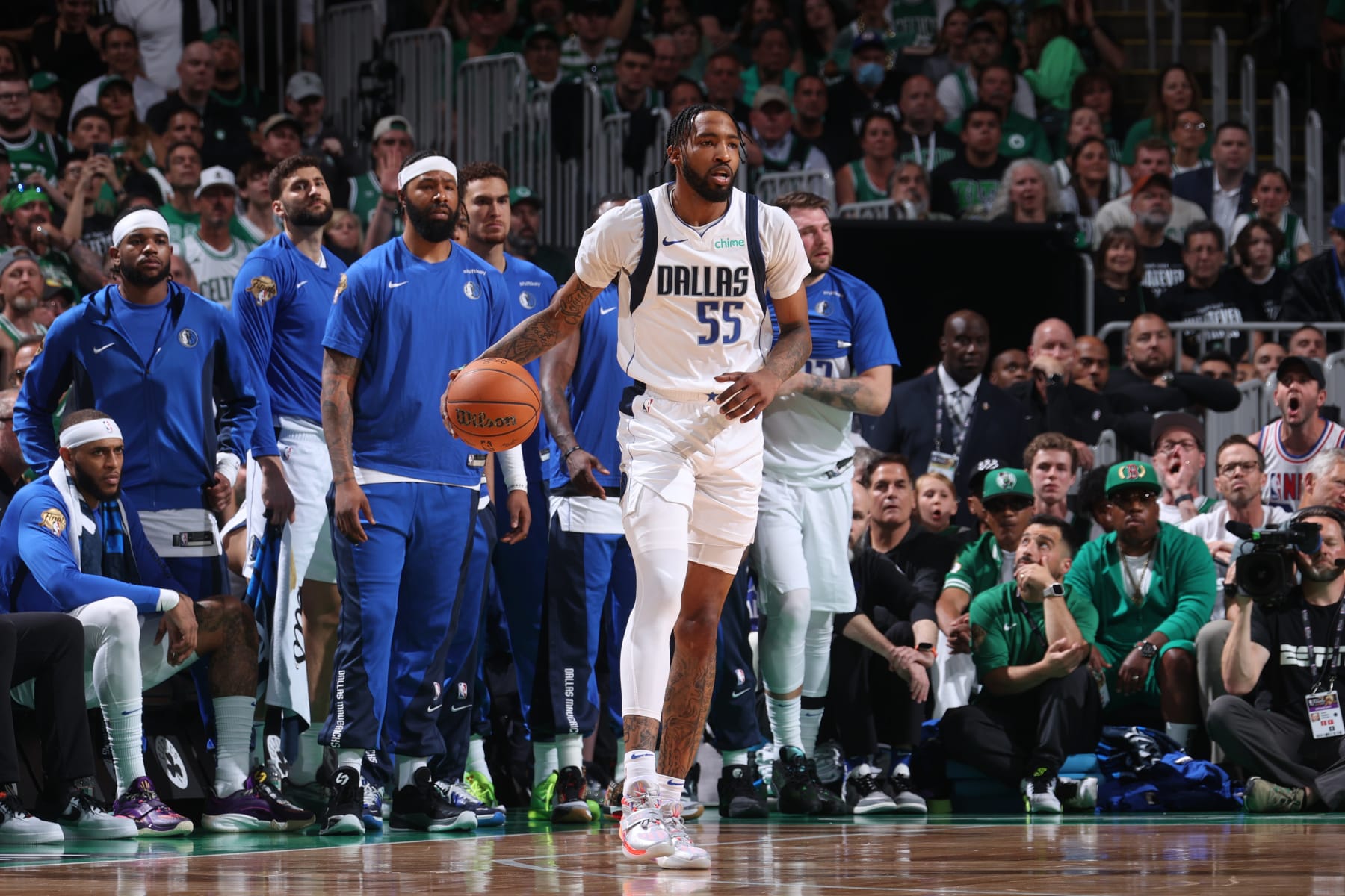 BOSTON, MA - JUNE 17: Derrick Jones Jr. #55 of the Dallas Mavericks dribbles the ball during the game against the Boston Celtics during Game 5 of the 2024 NBA Finals on June 17, 2024 at the TD Garden in Boston, Massachusetts. NOTE TO USER: User expressly acknowledges and agrees that, by downloading and or using this photograph, User is consenting to the terms and conditions of the Getty Images License Agreement. Mandatory Copyright Notice: Copyright 2024 NBAE  (Photo by Nathaniel S. Butler/NBAE via Getty Images)