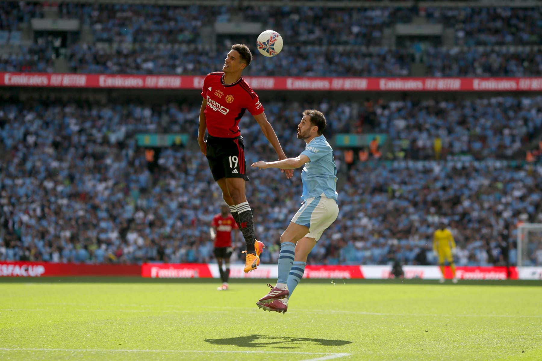 LONDON, ENGLAND - MAY 25: Raphael Varane of Manchester United heads away from Bernardo Silva of Manchester City during the Emirates FA Cup Final match between Manchester City and Manchester United at Wembley Stadium on May 25, 2024 in London, England. (Photo by Neal Simpson/Sportsphoto/Allstar via Getty Images)