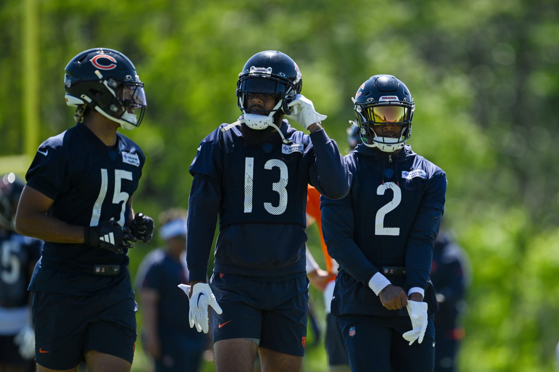 Chicago Bears wide receivers Rome Odunze (15), Keenan Allen (13) and DJ Moore (2)