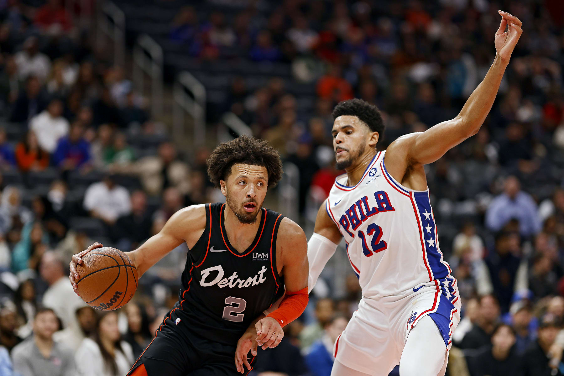 DETROIT, MICHIGAN - NOVEMBER 10: Cade Cunningham #2 of the Detroit Pistons drives the ball against Tobias Harris #12 of the Philadelphia 76ers in the fourth quarter of a game at Little Caesars Arena on November 10, 2023 in Detroit, Michigan. NOTE TO USER: User expressly acknowledges and agrees that, by downloading and or using this photograph, User is consenting to the terms and conditions of the Getty Images License Agreement. (Photo by Mike Mulholland/Getty Images)