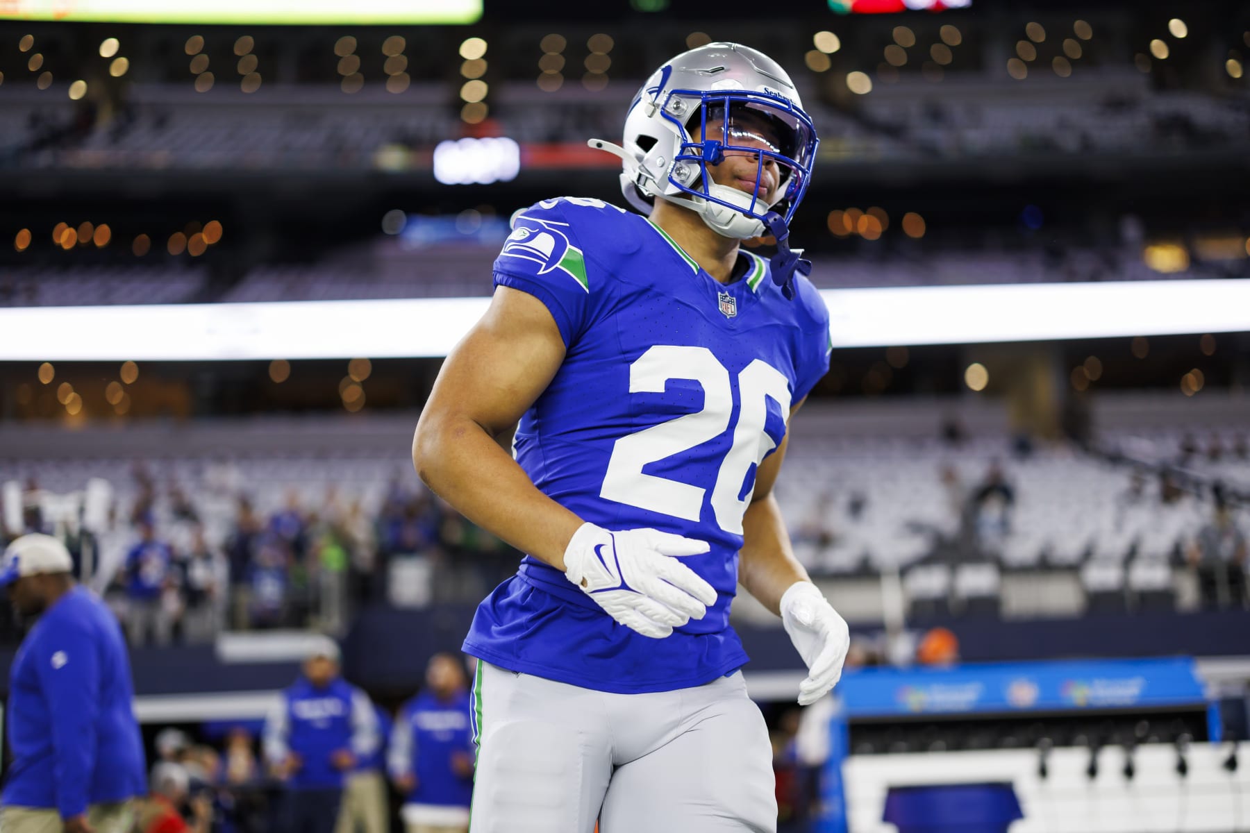 ARLINGTON, TEXAS - NOVEMBER 30: Zach Charbonnet #26 of the Seattle Seahawks runs onto the field during pregame warmups before an NFL football game against the Dallas Cowboys at AT&T Stadium on November 30, 2023 in Arlington, Texas. (Photo by Ryan Kang/Getty Images)
