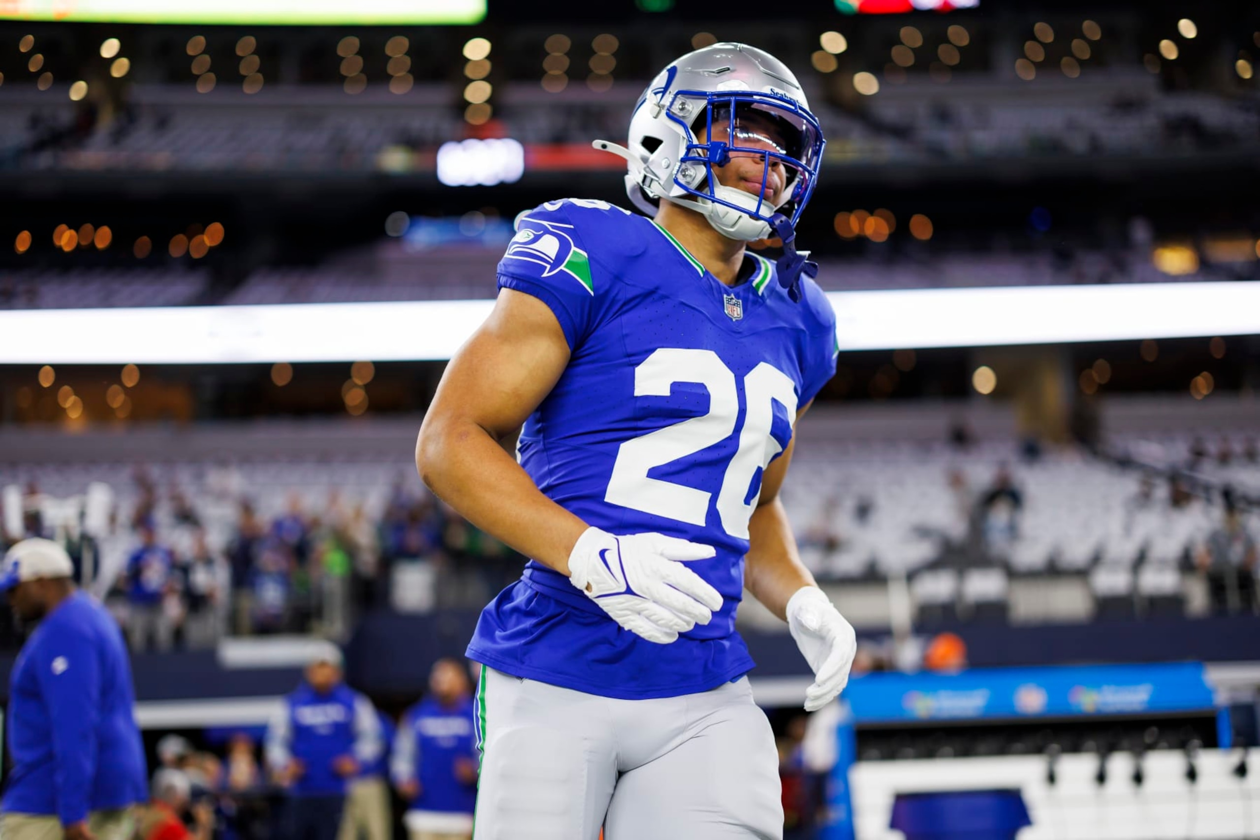 ARLINGTON, TEXAS - NOVEMBER 30: Zach Charbonnet #26 of the Seattle Seahawks runs onto the field during pregame warmups before an NFL football game against the Dallas Cowboys at AT&T Stadium on November 30, 2023 in Arlington, Texas. (Photo by Ryan Kang/Getty Images)
