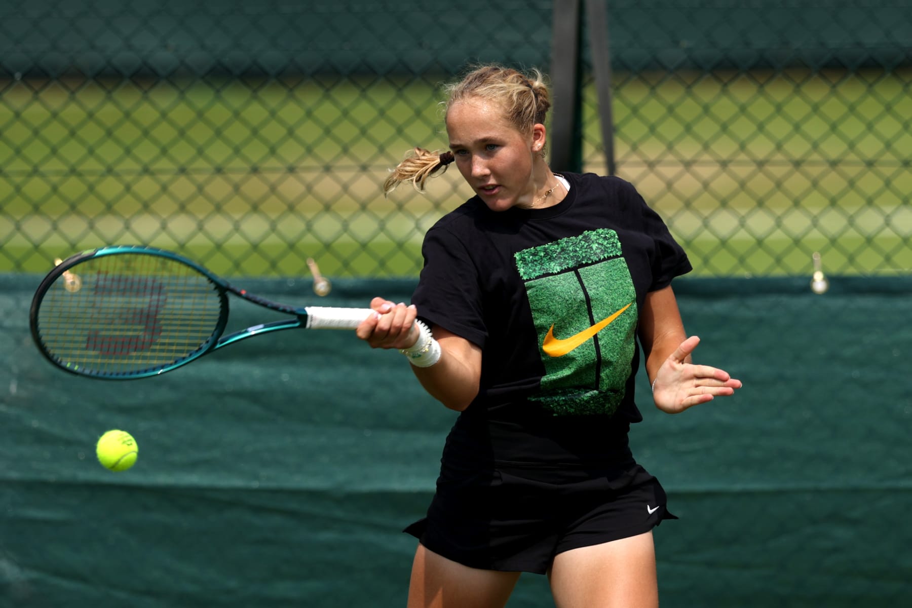 LONDON, ENGLAND - JUNE 25: Mirra Andreeva plays a forehand during practice prior to The Championships Wimbledon 2024 at All England Lawn Tennis and Croquet Club on June 25, 2024 in London, England. (Photo by Clive Brunskill/Getty Images)