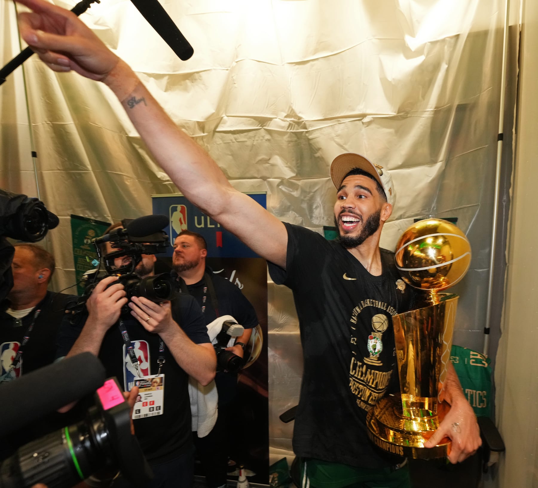 BOSTON, MA - JUNE 17: Jayson Tatum #0 of the Boston Celtics celebrates with the Larry O'Brien Trophy after the game against the Dallas Mavericks during Game 5 of the 2024 NBA Finals on June 17, 2024 at the TD Garden in Boston, Massachusetts. NOTE TO USER: User expressly acknowledges and agrees that, by downloading and or using this photograph, User is consenting to the terms and conditions of the Getty Images License Agreement. Mandatory Copyright Notice: Copyright 2024 NBAE  (Photo by Jesse D. Garrabrant/NBAE via Getty Images)