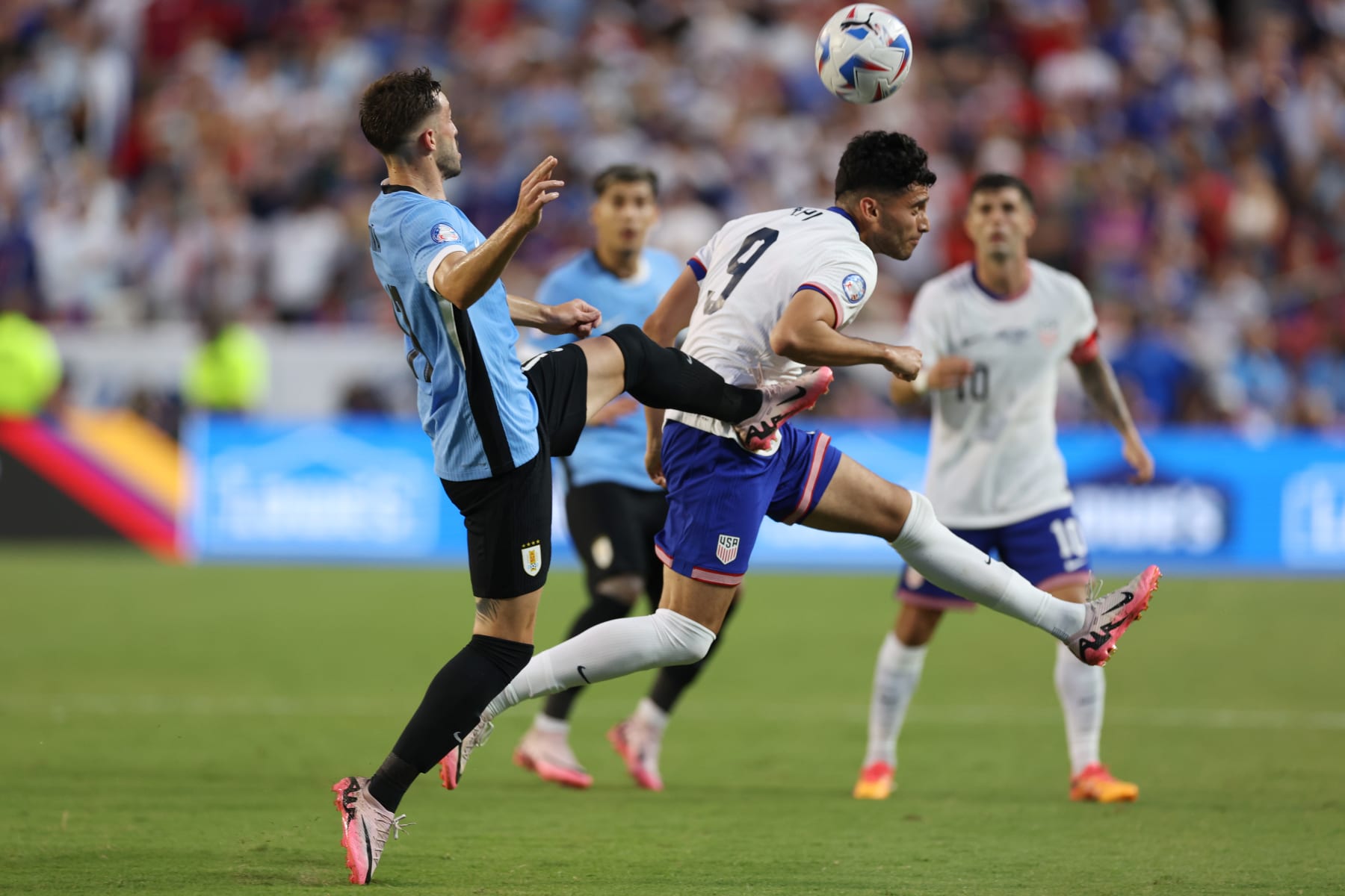 KANSAS CITY, MISSOURI - JULY 01: Ricardo Pepi of United States heads the ball against Matias Viña of Uruguay during the CONMEBOL Copa America 2024 Group C match between United States and Uruguay at GEHA Field at Arrowhead Stadium on July 01, 2024 in Kansas City, Missouri. (Photo by Jamie Squire/Getty Images)