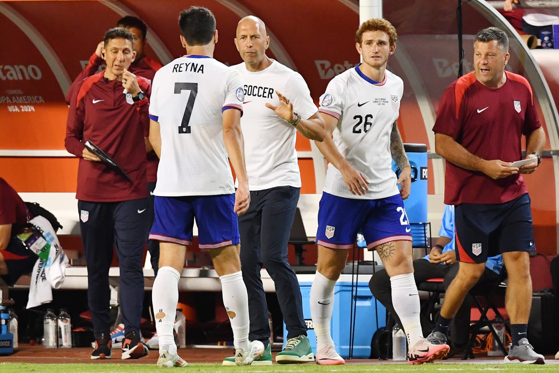 KANSAS CITY, MISSOURI - JULY 01: United States head coach Gregg Berhalter talks with Gio Reyna #7 during the second half against Uruguay at GEHA Field at Arrowhead Stadium on July 01, 2024 in Kansas City, Missouri. (Photo by Bill Barrett/ISI Photos/USSF/Getty Images for USSF)