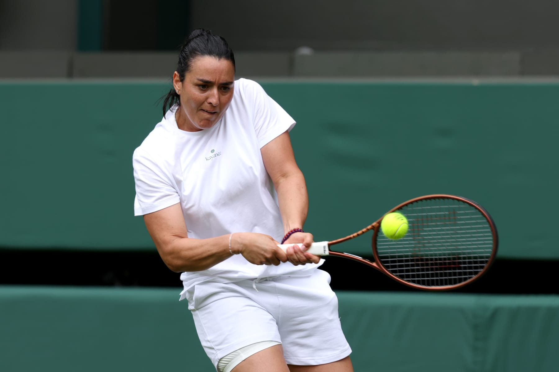 LONDON, ENGLAND - JUNE 28: Ons Jabeur of Tunisa plays a backhand during practice prior to The Championships Wimbledon 2024 at All England Lawn Tennis and Croquet Club on June 28, 2024 in London, England. (Photo by Clive Brunskill/Getty Images)
