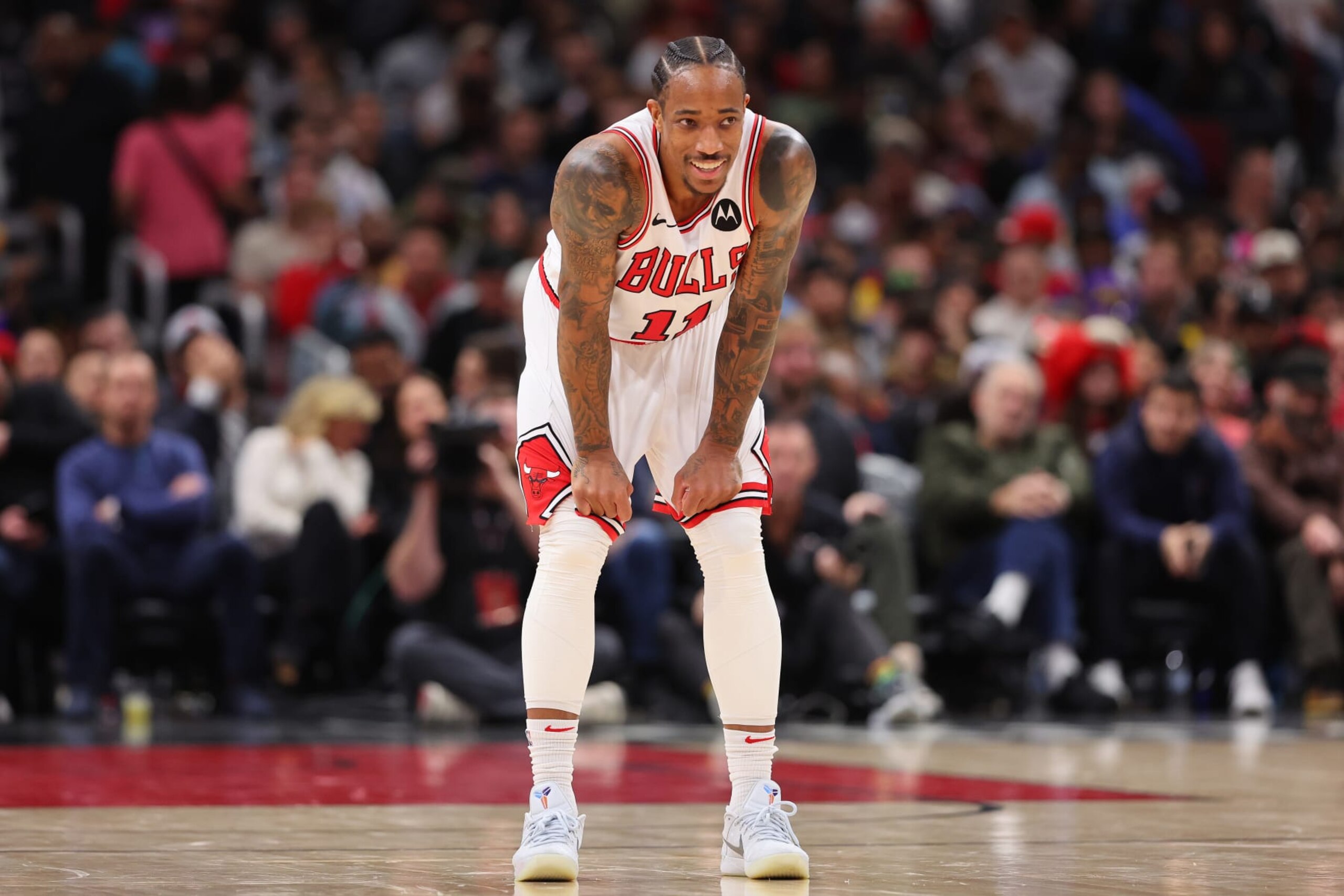 CHICAGO, ILLINOIS - DECEMBER 20: DeMar DeRozan #11 of the Chicago Bulls laughs against the Los Angeles Lakers during the second half at the United Center on December 20, 2023 in Chicago, Illinois. NOTE TO USER: User expressly acknowledges and agrees that, by downloading and or using this photograph, User is consenting to the terms and conditions of the Getty Images License Agreement. (Photo by Michael Reaves/Getty Images) CHICAGO, ILLINOIS - DECEMBER 20: DeMar DeRozan #11 of the Chicago Bulls laughs against the Los Angeles Lakers during the second half at the United Center on December 20, 2023 in Chicago, Illinois. NOTE TO USER: User expressly acknowledges and agrees that, by downloading and or using this photograph, User is consenting to the terms and conditions of the Getty Images License Agreement. (Photo by Michael Reaves/Getty Images)
