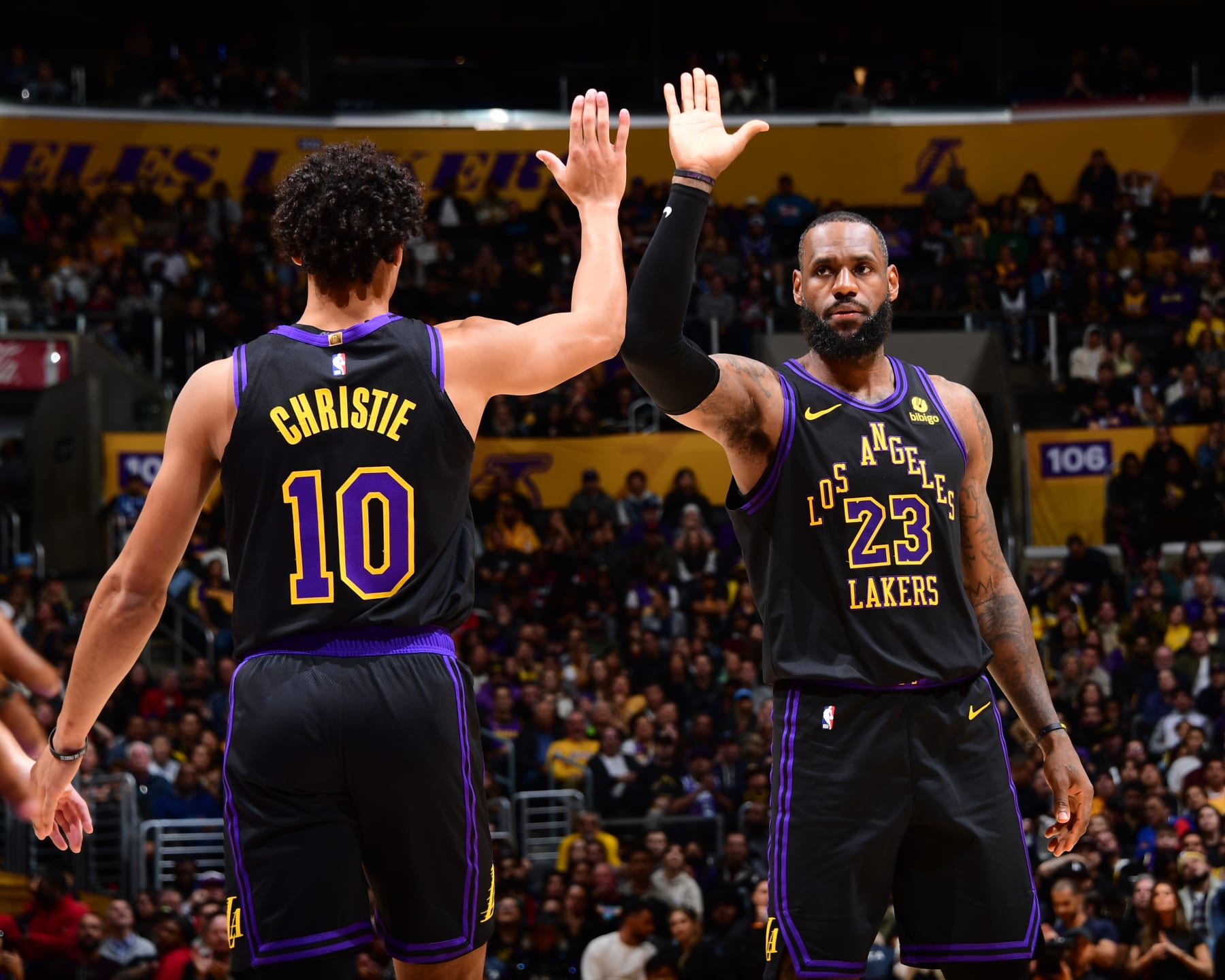 LOS ANGELES, CA - JANUARY 9: Max Christie #10 high fives LeBron James #23 of the Los Angeles Lakers during the game against the Toronto Raptors on January 9, 2024 at Crypto.Com Arena in Los Angeles, California. NOTE TO USER: User expressly acknowledges and agrees that, by downloading and/or using this Photograph, user is consenting to the terms and conditions of the Getty Images License Agreement. Mandatory Copyright Notice: Copyright 2024 NBAE (Photo by Adam Pantozzi/NBAE via Getty Images)