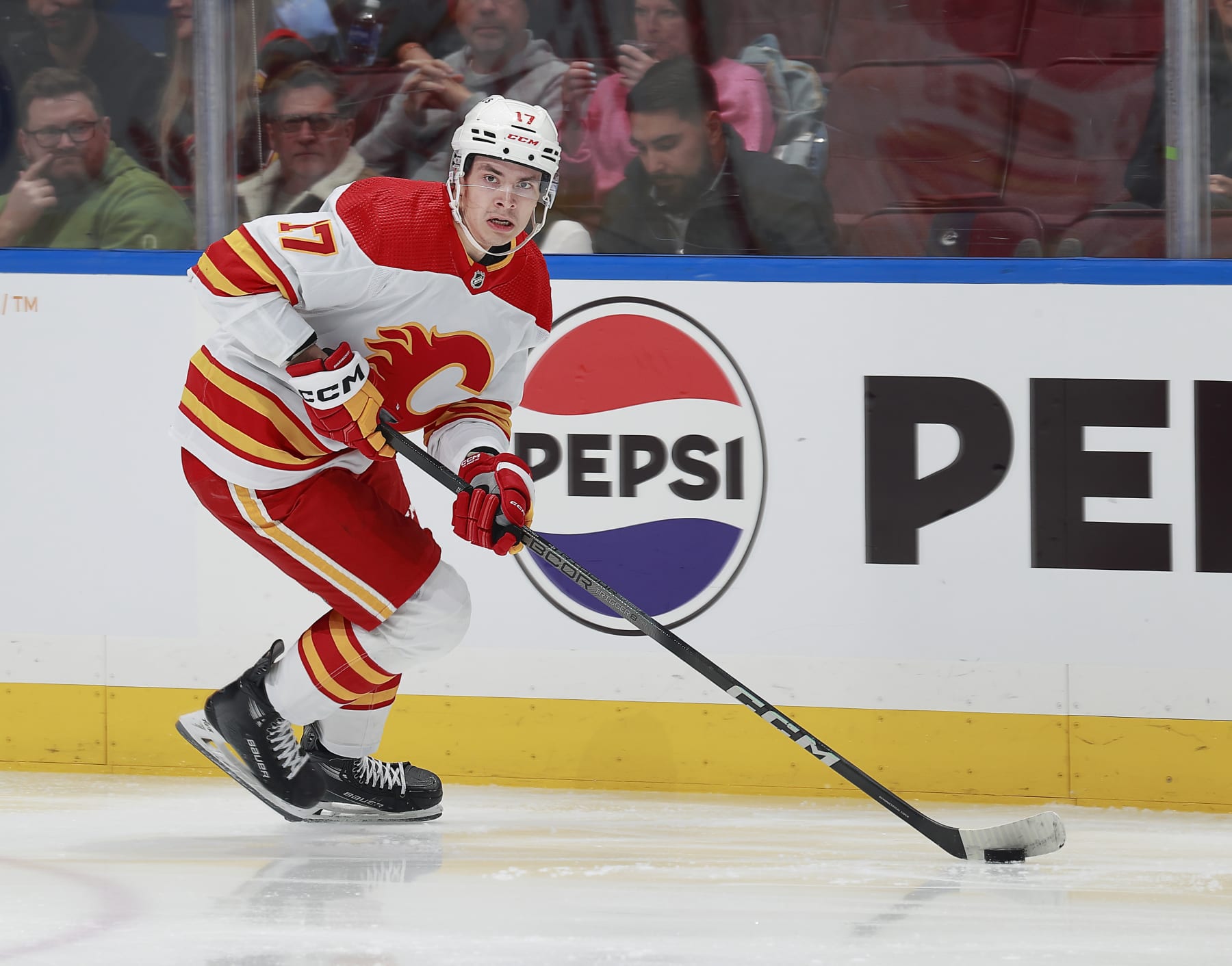 VANCOUVER, CANADA - APRIL 16: Yegor Sharangovich #17 of the Calgary Flames skates up ice during their NHL game against the Vancouver Canucks at Rogers Arena on April 16, 2024 in Vancouver, British Columbia, Canada. (Photo by Jeff Vinnick/NHLI via Getty Images)