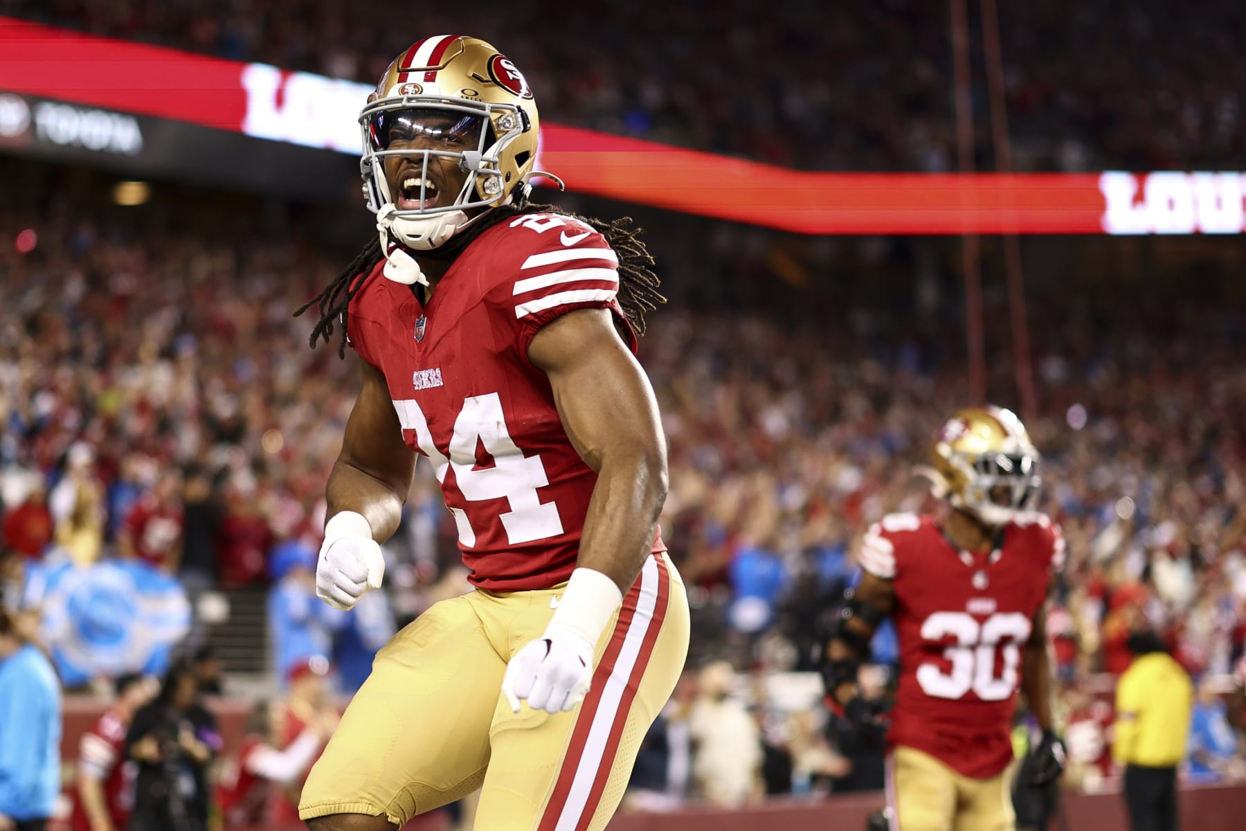 SANTA CLARA, CA - JANUARY 28: Jordan Mason #24 of the San Francisco 49ers celebrates after a play during the NFC Championship NFL football game against the Detroit Lions at Levi's Stadium on January 28, 2024 in Santa Clara, California. (Photo by Kevin Sabitus/Getty Images)