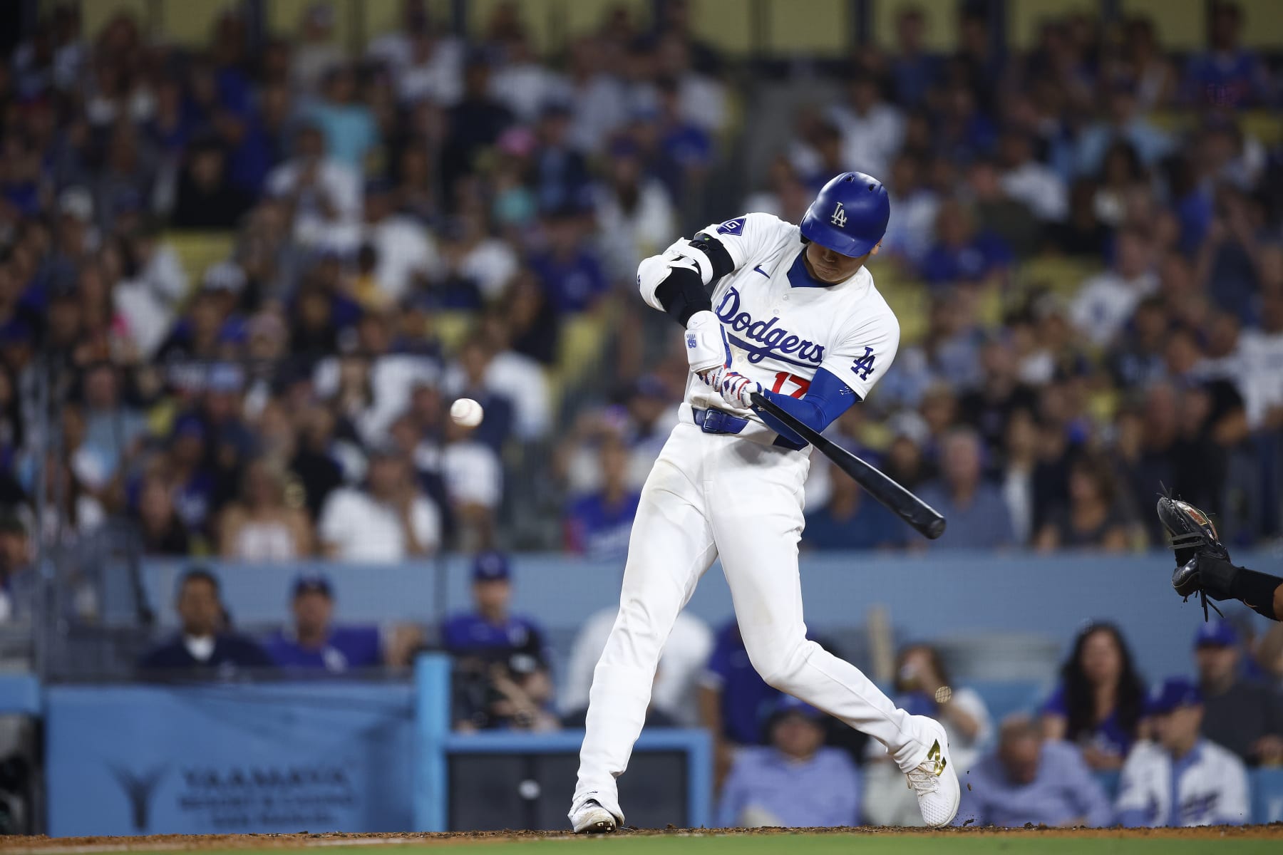 LOS ANGELES, CALIFORNIA - JULY 02:  Shohei Ohtani #17 of the Los Angeles Dodgers hits a two-run home run against the Arizona Diamondback in the seventh inning at Dodger Stadium on July 02, 2024 in Los Angeles, California. (Photo by Ronald Martinez/Getty Images)