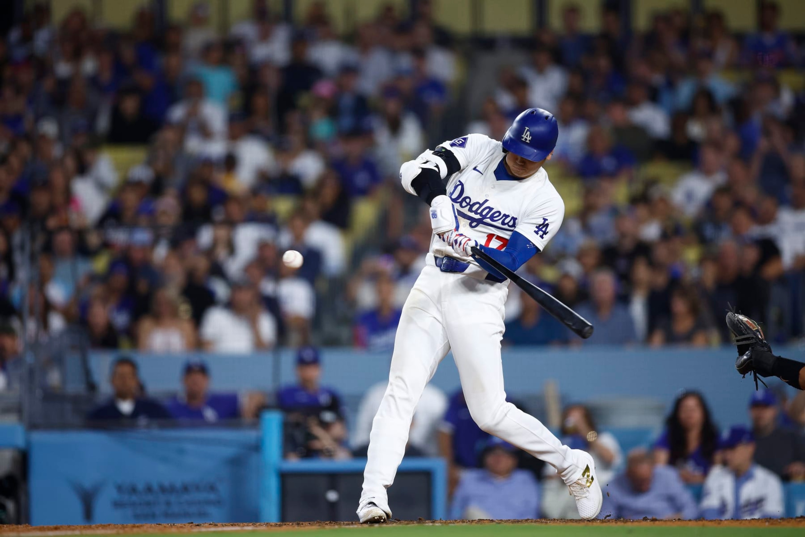 LOS ANGELES, CALIFORNIA - JULY 02:  Shohei Ohtani #17 of the Los Angeles Dodgers hits a two-run home run against the Arizona Diamondback in the seventh inning at Dodger Stadium on July 02, 2024 in Los Angeles, California. (Photo by Ronald Martinez/Getty Images)