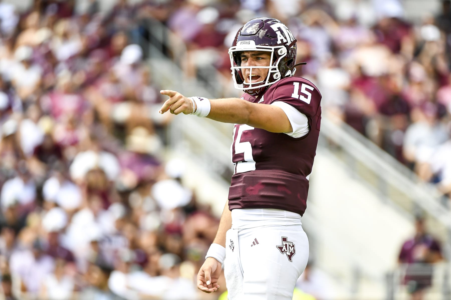 COLLEGE STATION, TEXAS - SEPTEMBER 23: Quarterback Conner Weigman #15 of the Texas A&M Aggies directs the offense during the first half against the Auburn Tigers at Kyle Field on September 23, 2023 in College Station, Texas. (Photo by Logan Riely/Getty Images)