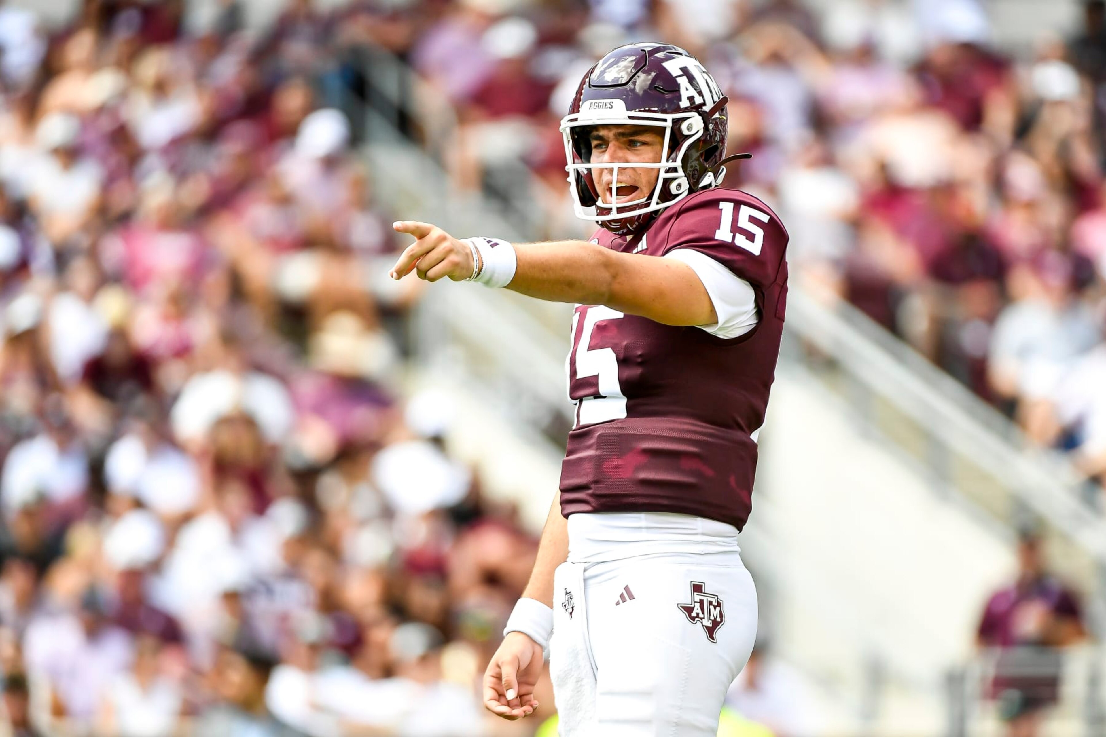 COLLEGE STATION, TEXAS - SEPTEMBER 23: Quarterback Conner Weigman #15 of the Texas A&M Aggies directs the offense during the first half against the Auburn Tigers at Kyle Field on September 23, 2023 in College Station, Texas. (Photo by Logan Riely/Getty Images)