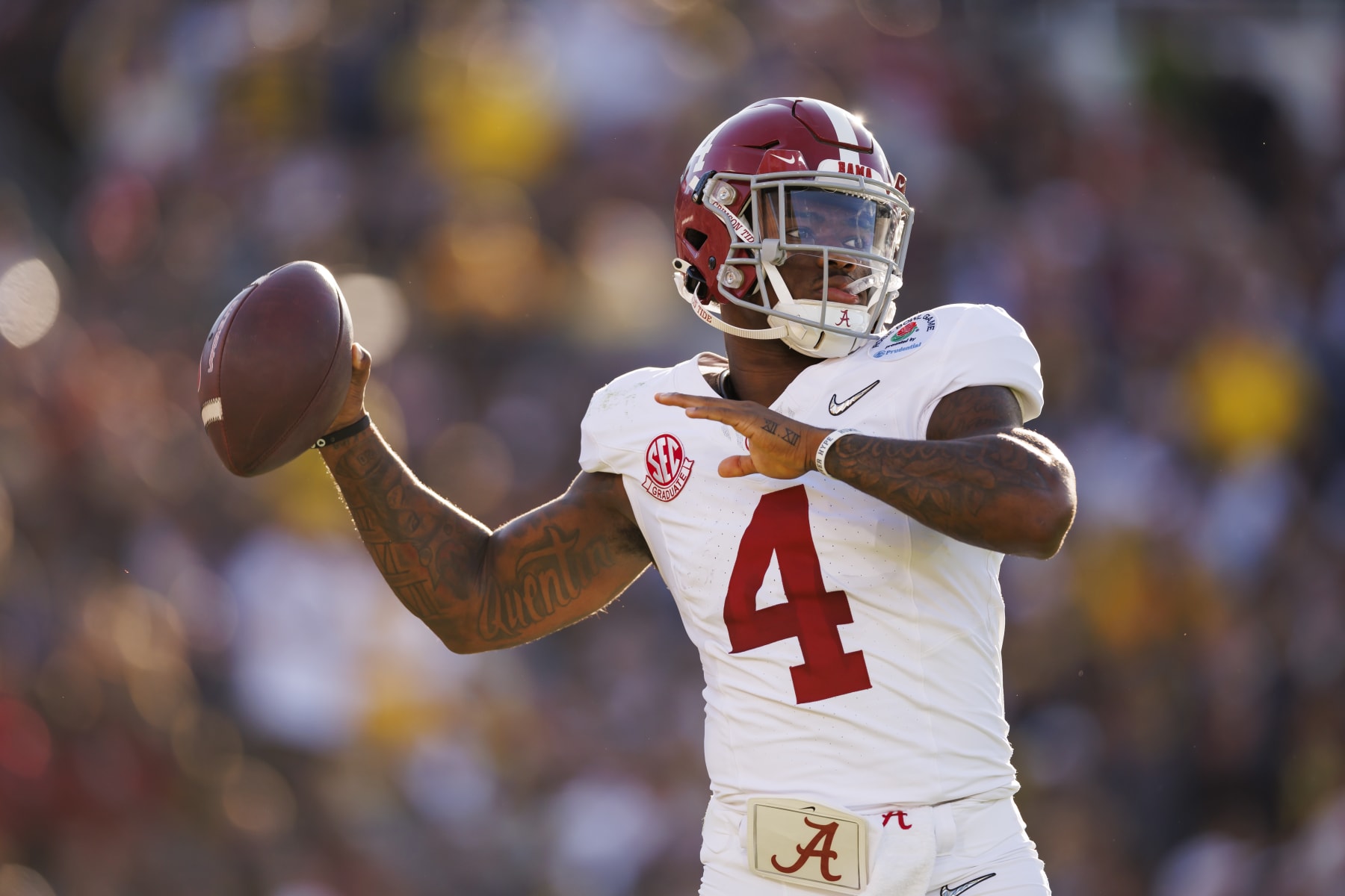 PASADENA, CALIFORNIA - JANUARY 01: Quarterback Jalen Milroe #4 of the Alabama Crimson Tide looks to throw a pass on the sideline during the CFP Semifinal Rose Bowl Game against the Michigan Wolverines at Rose Bowl Stadium on January 1, 2024 in Pasadena, California. (Photo by Ryan Kang/Getty Images)