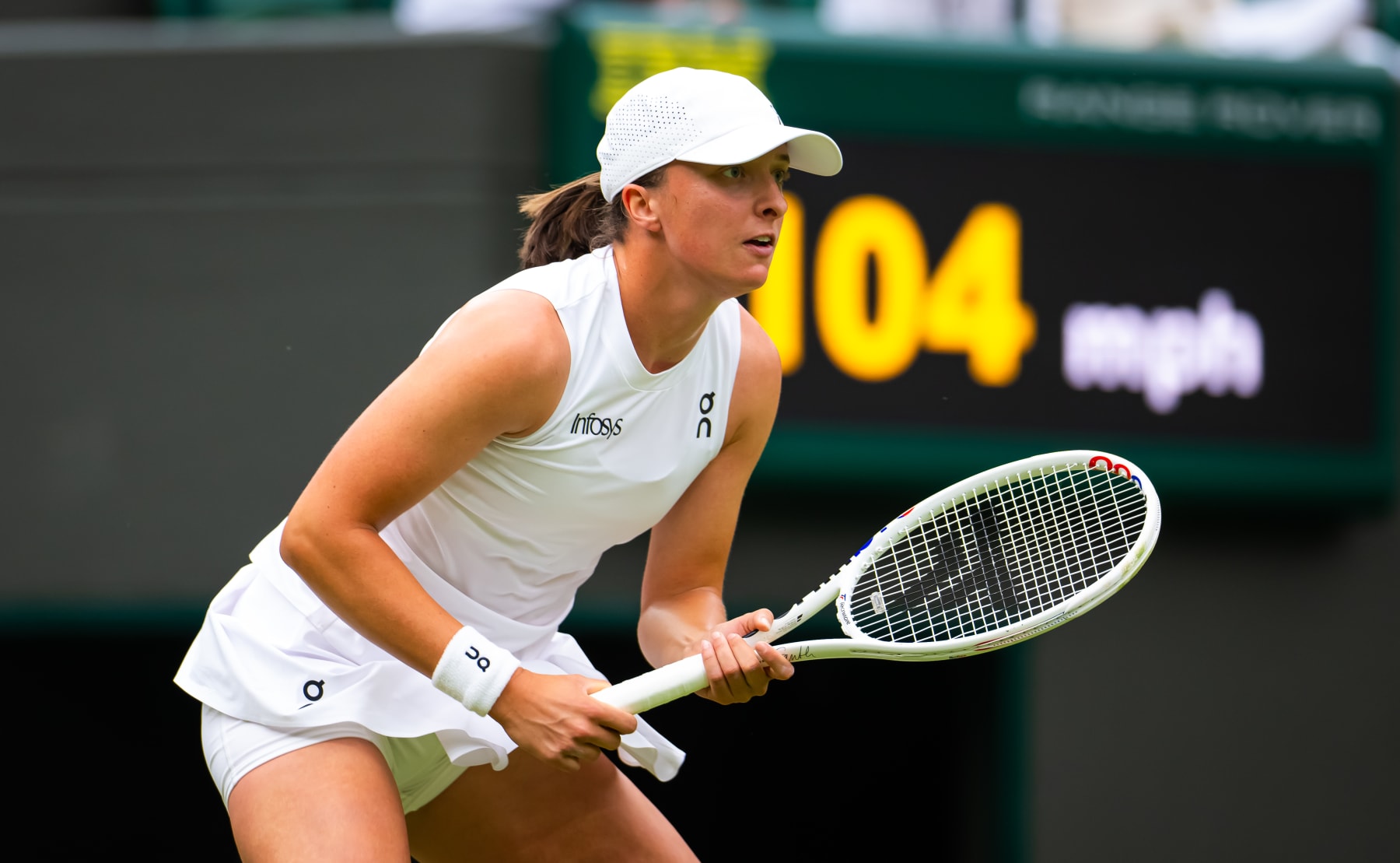LONDON, ENGLAND - JULY 02: Iga Swiatek of Poland in action against Sofia Kenin of the United States in the first round on Day Two of The Championships Wimbledon 2024 at All England Lawn Tennis and Croquet Club on July 02, 2024 in London, England (Photo by Robert Prange/Getty Images)