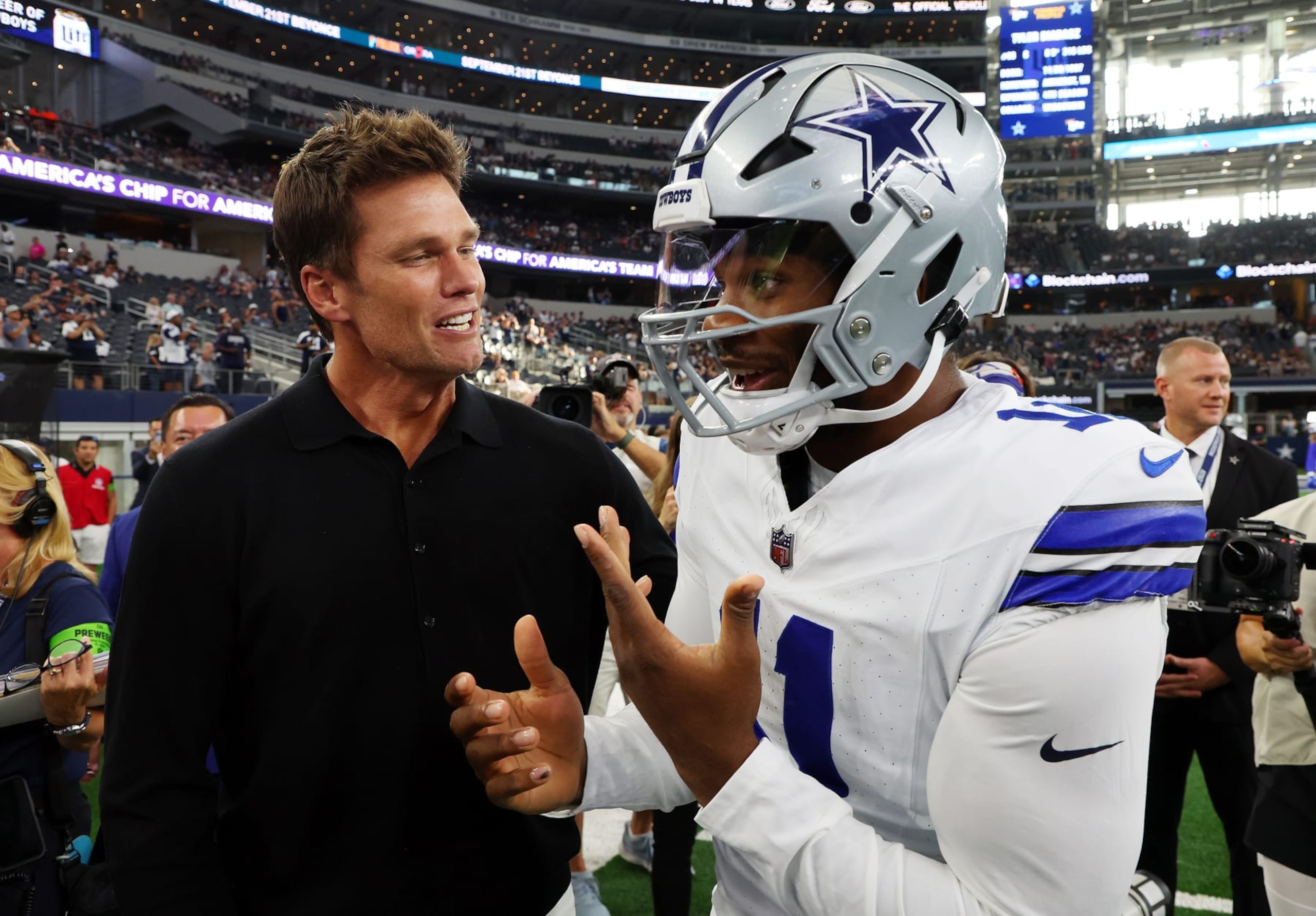 ARLINGTON, TEXAS - AUGUST 26: Tom Brady jokes with Micah Parsons #11 of the Dallas Cowboys before a preseason game against the Las Vegas Raiders at AT&T Stadium on August 26, 2023 in Arlington, Texas. (Photo by Richard Rodriguez/Getty Images) ARLINGTON, TEXAS - AUGUST 26: Tom Brady jokes with Micah Parsons #11 of the Dallas Cowboys before a preseason game against the Las Vegas Raiders at AT&T Stadium on August 26, 2023 in Arlington, Texas. (Photo by Richard Rodriguez/Getty Images)